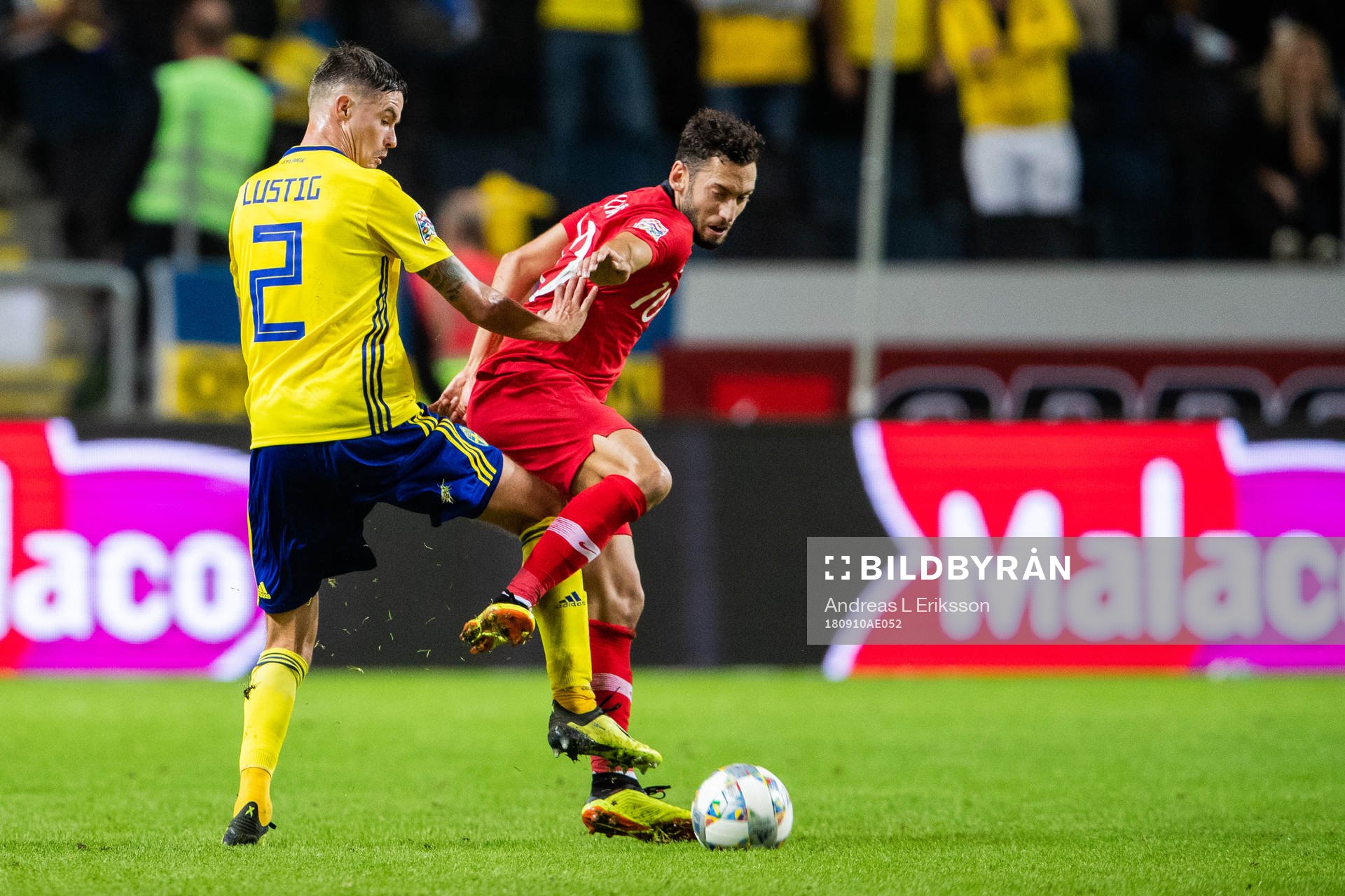 Mikael Lustig of Sweden and Hakan Calhanoglu of Turkey