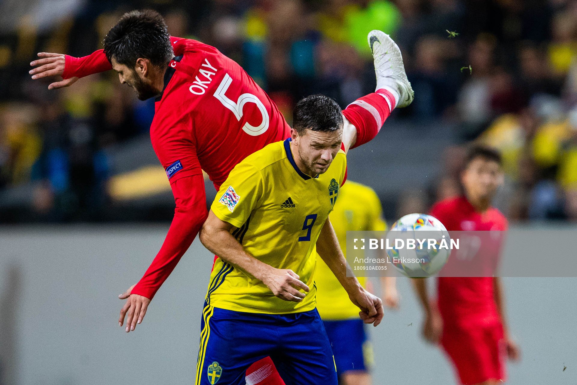 Okay Yokuslu of Turkey and Marcus Berg of Sweden