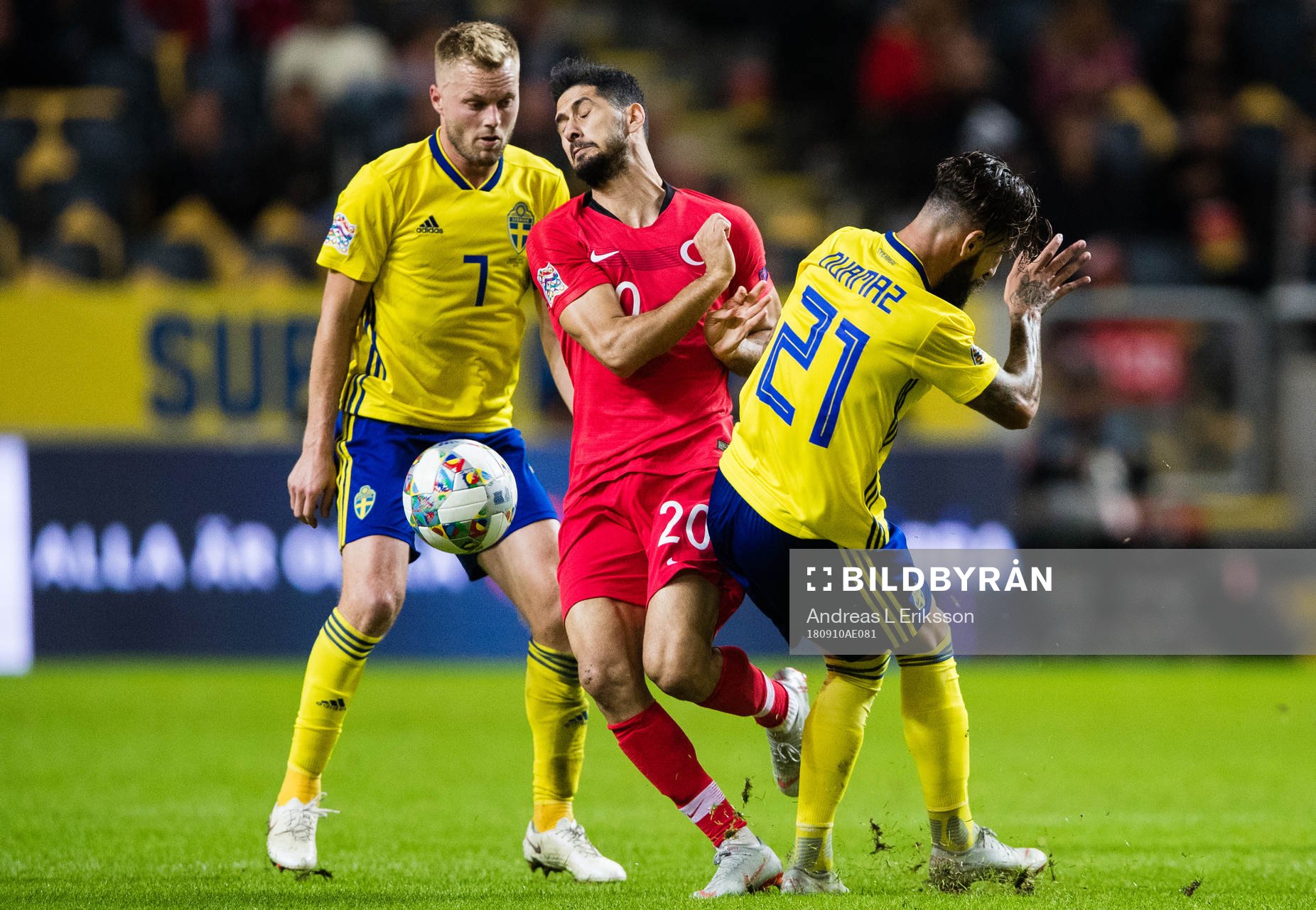 Sebastian Larsson and Jimmy Durmaz stops Emre Akbaba of Turkey during the Nations League match between Sweden and Turkey on september 10, 2018 in Stockholm.