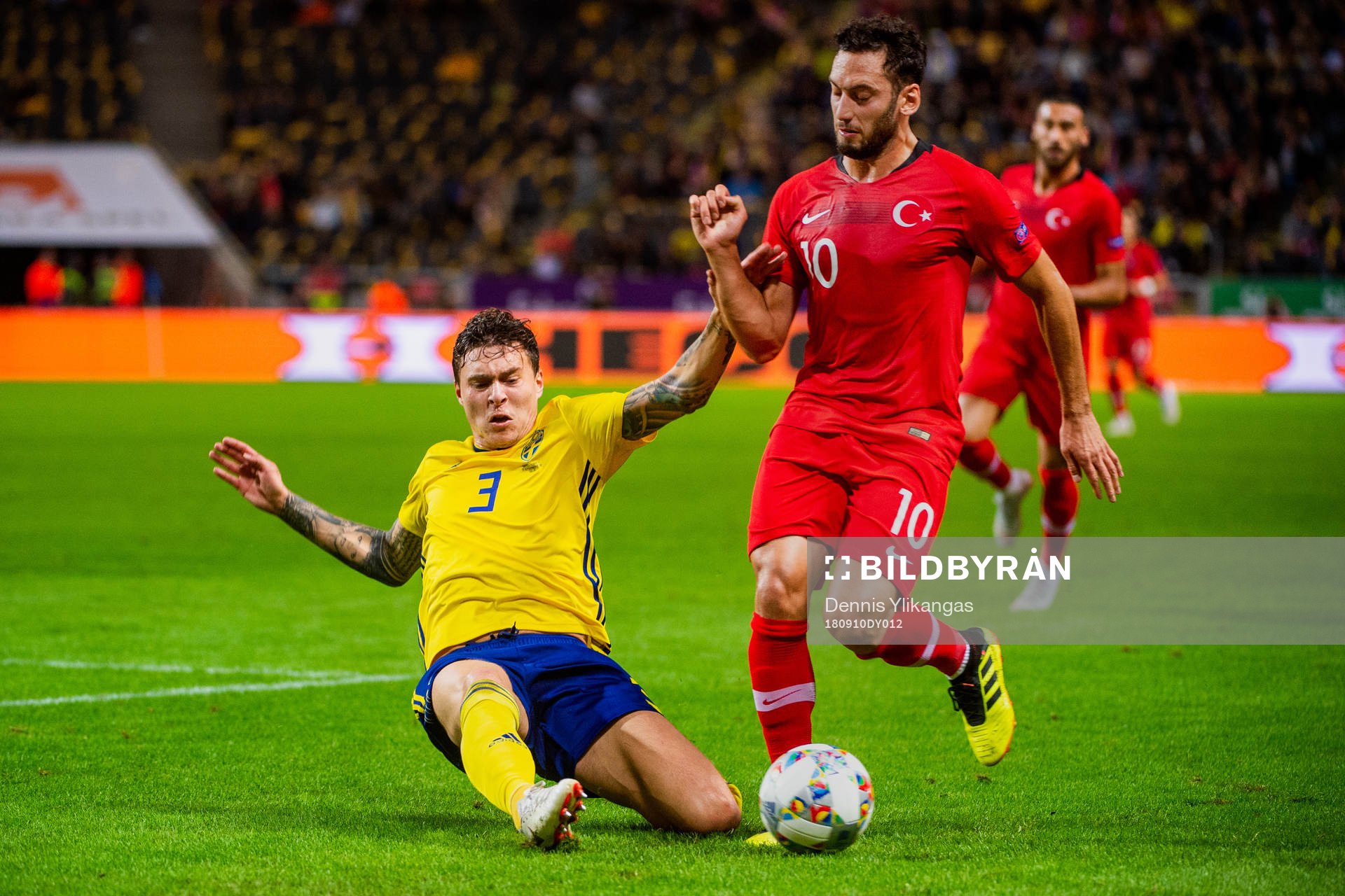Victor Nilsson Lindelöf of Sweden and Hakan Calhanoglu of