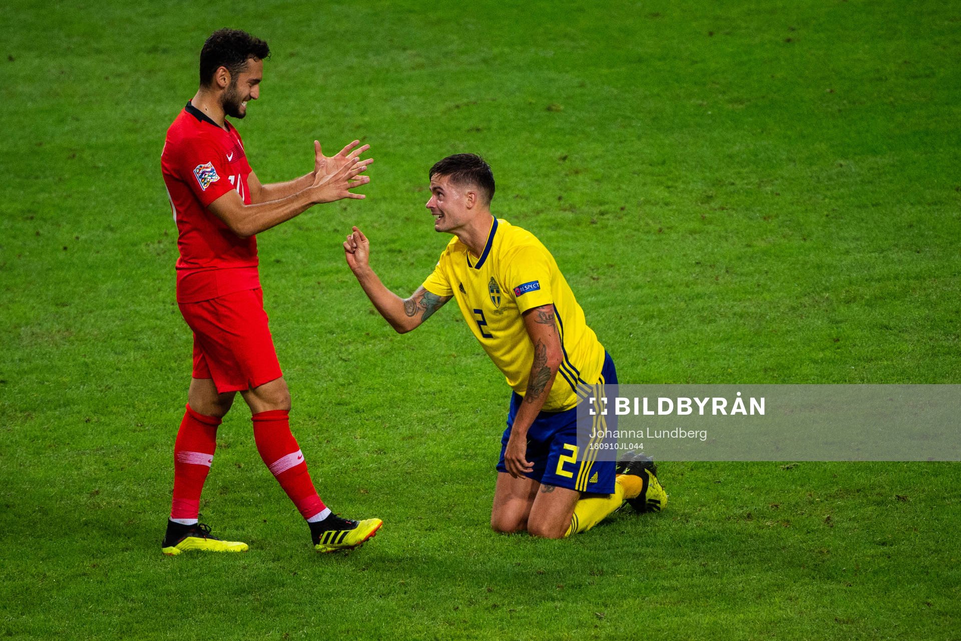 Emre Akbaba of Turkey and Mikael Lustig of Sweden during the Nations League match between Sweden and Turkey on september 10, 2018 in Stockholm.