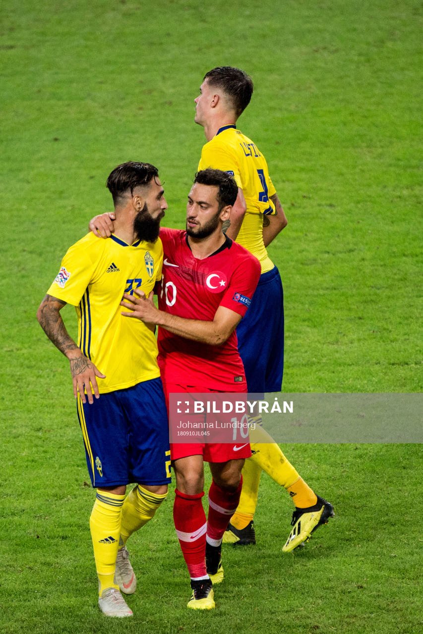Jimmy Durmaz of Sweden and Hakan Calhanoglu of Turkey