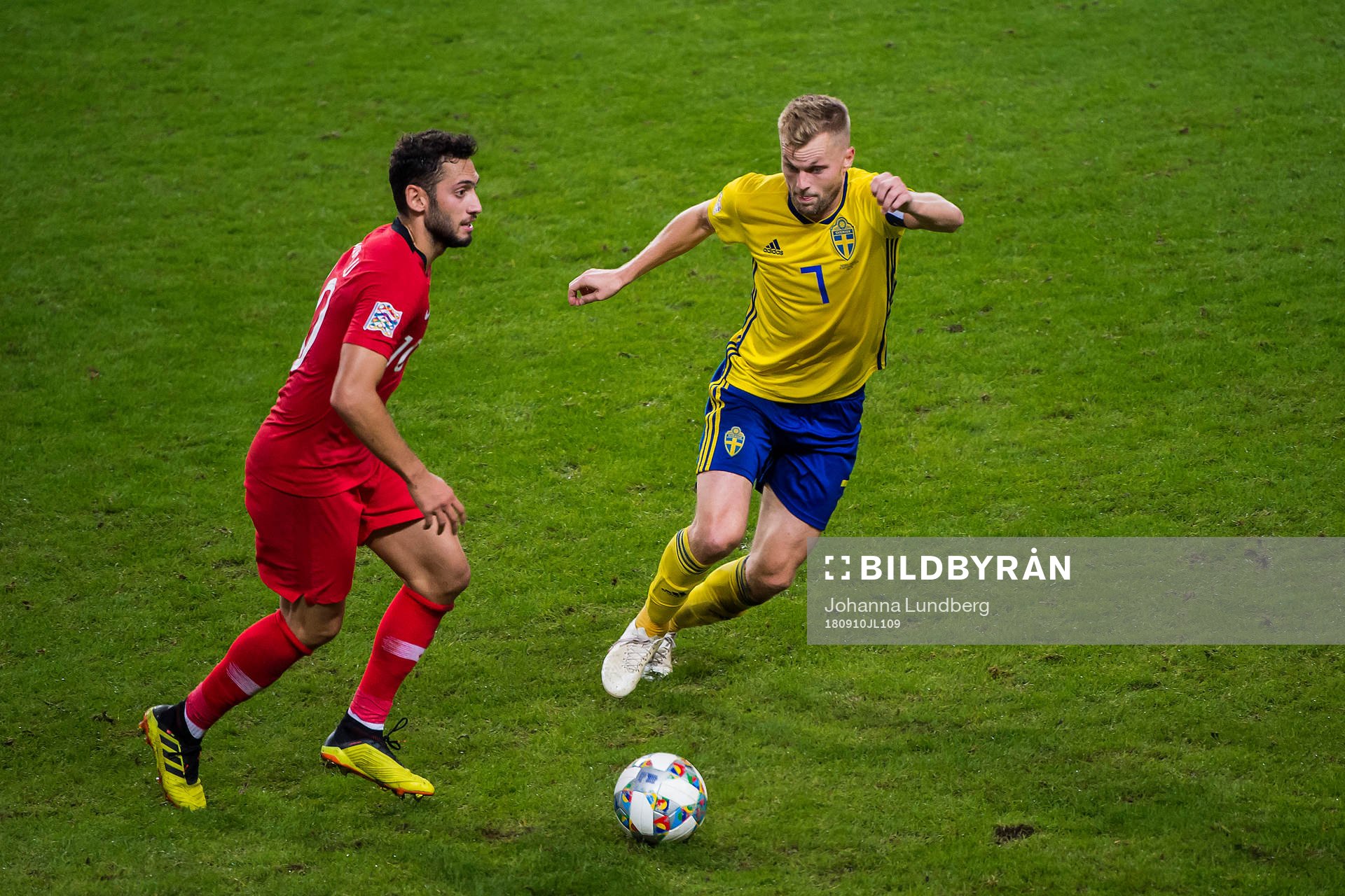 Hakan Calhanoglu of Turkey and Sebastian Larsson of Sweden