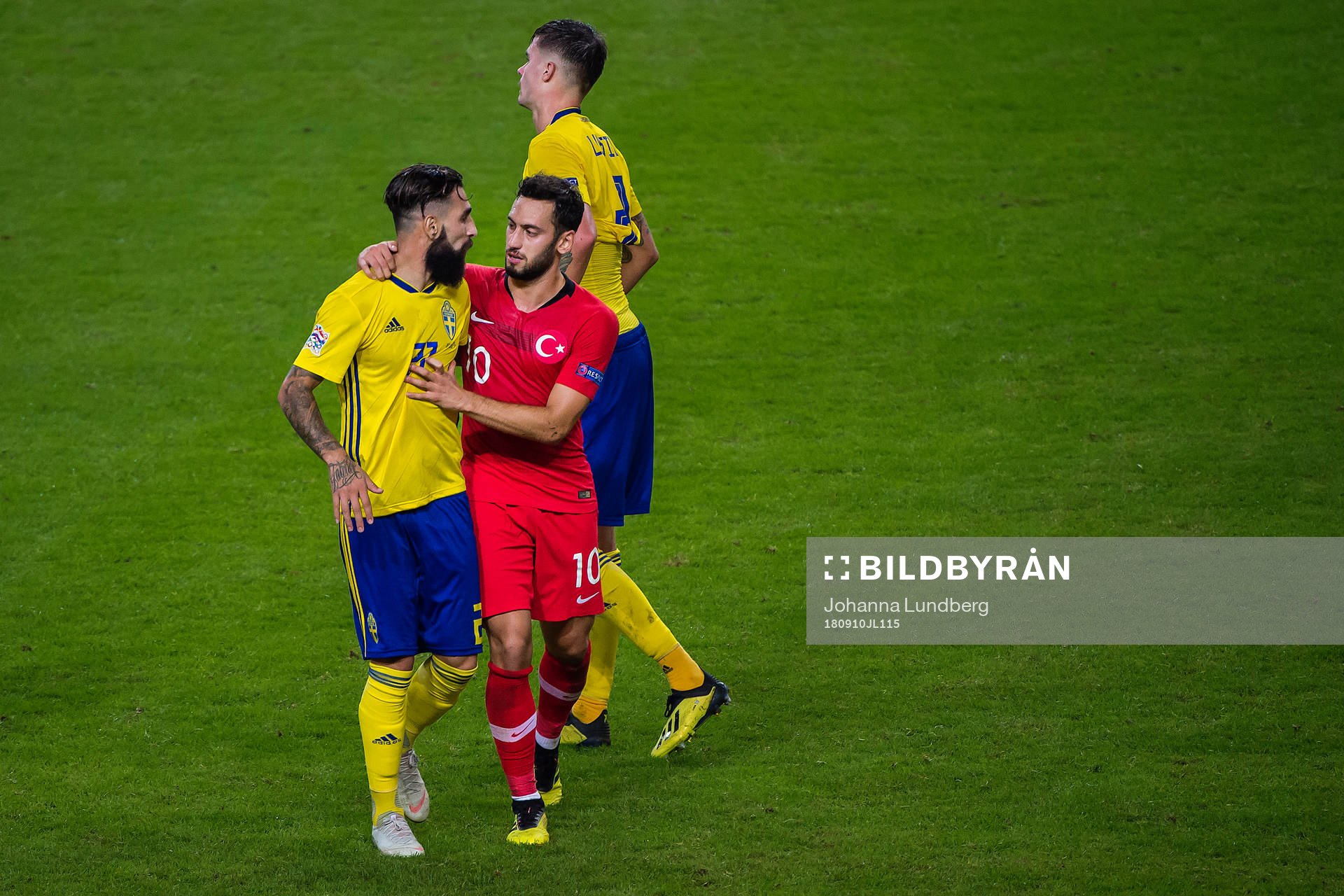 Jimmy Durmaz of Sweden and Hakan Calhanoglu of Turkey