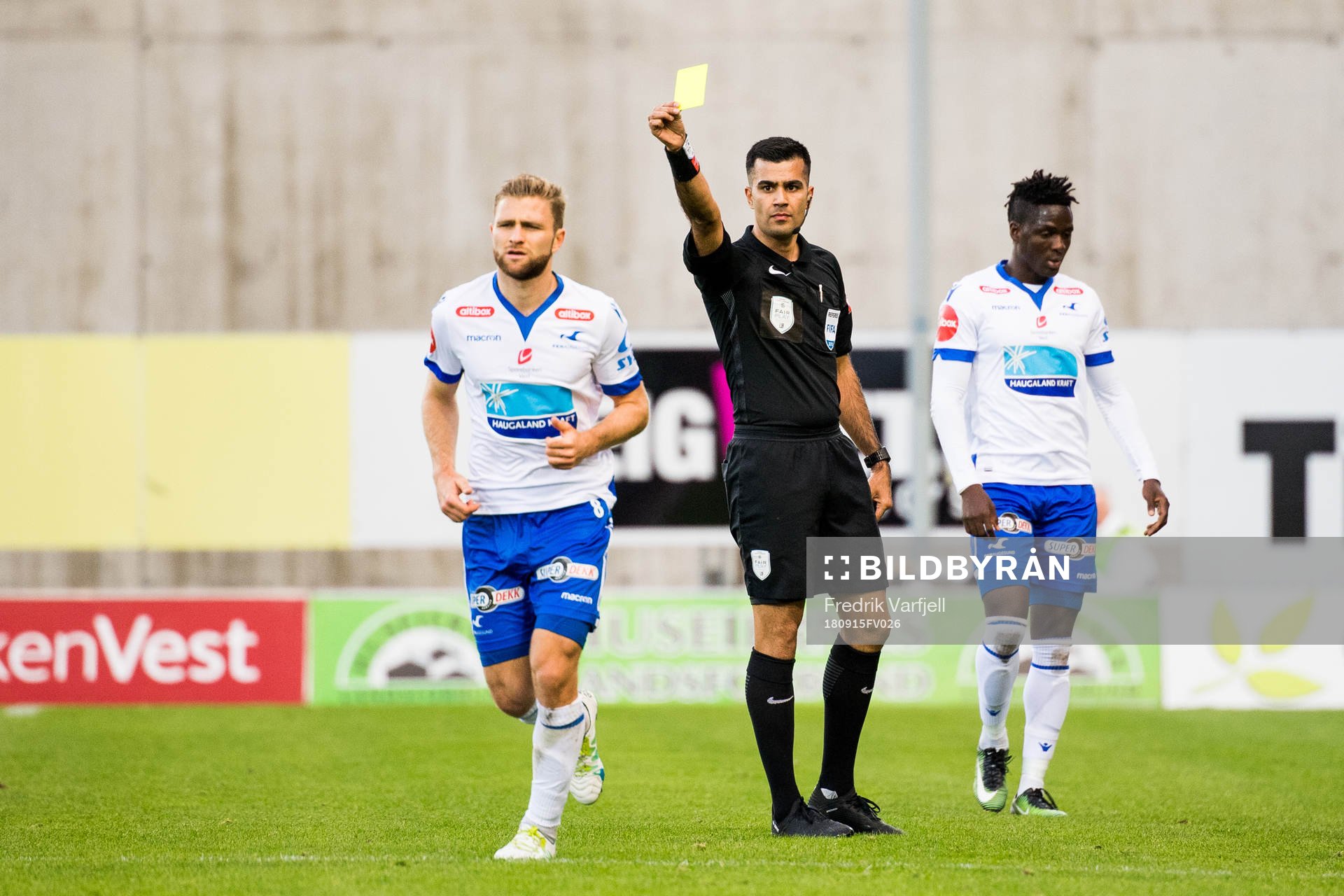 Sondre Tronstad of Haugesund is shown a yellow card by