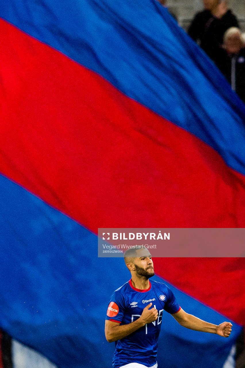 Amin Nouri of Vålerenga celebrates with his teammates after scoring the 2-2 goal during the Eliteserien match between Vålerenga and Rosenborg on September 16, 2018 in Oslo.