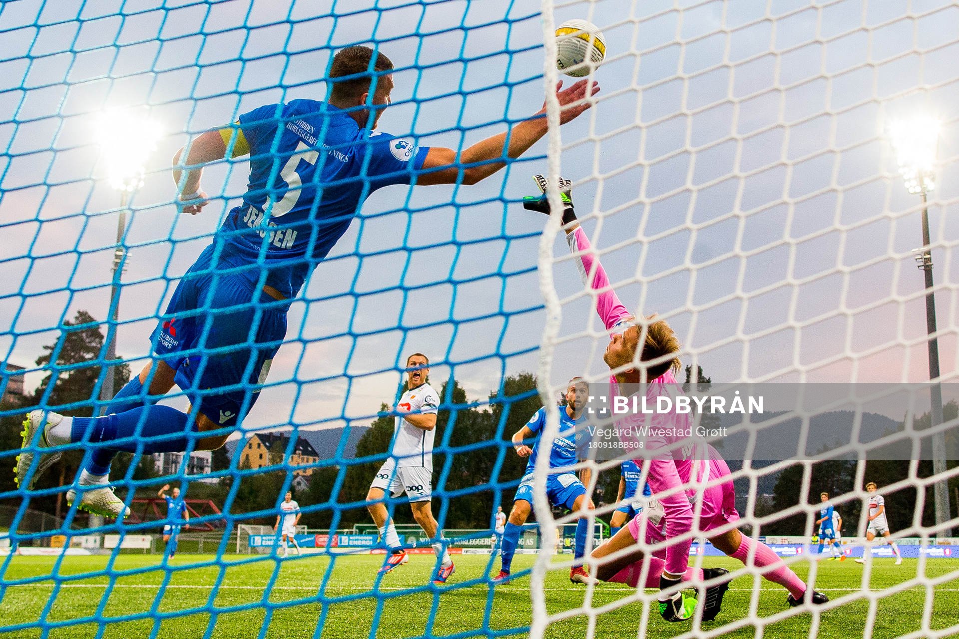 Tommy Høiland of Viking scores 0-1 past Steffen Jenssen and goalkeeper Nils Jonathan Johansson of Notodden during the OBOS-ligaen match between Notodden and Viking on September 18, 2018 in Notodden.