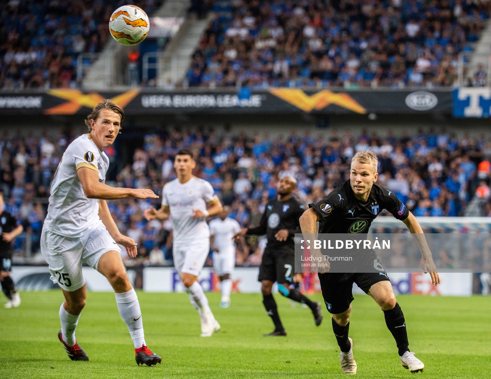 Sander Berge of Genk and Oscar Lewicki of Malmö FF
