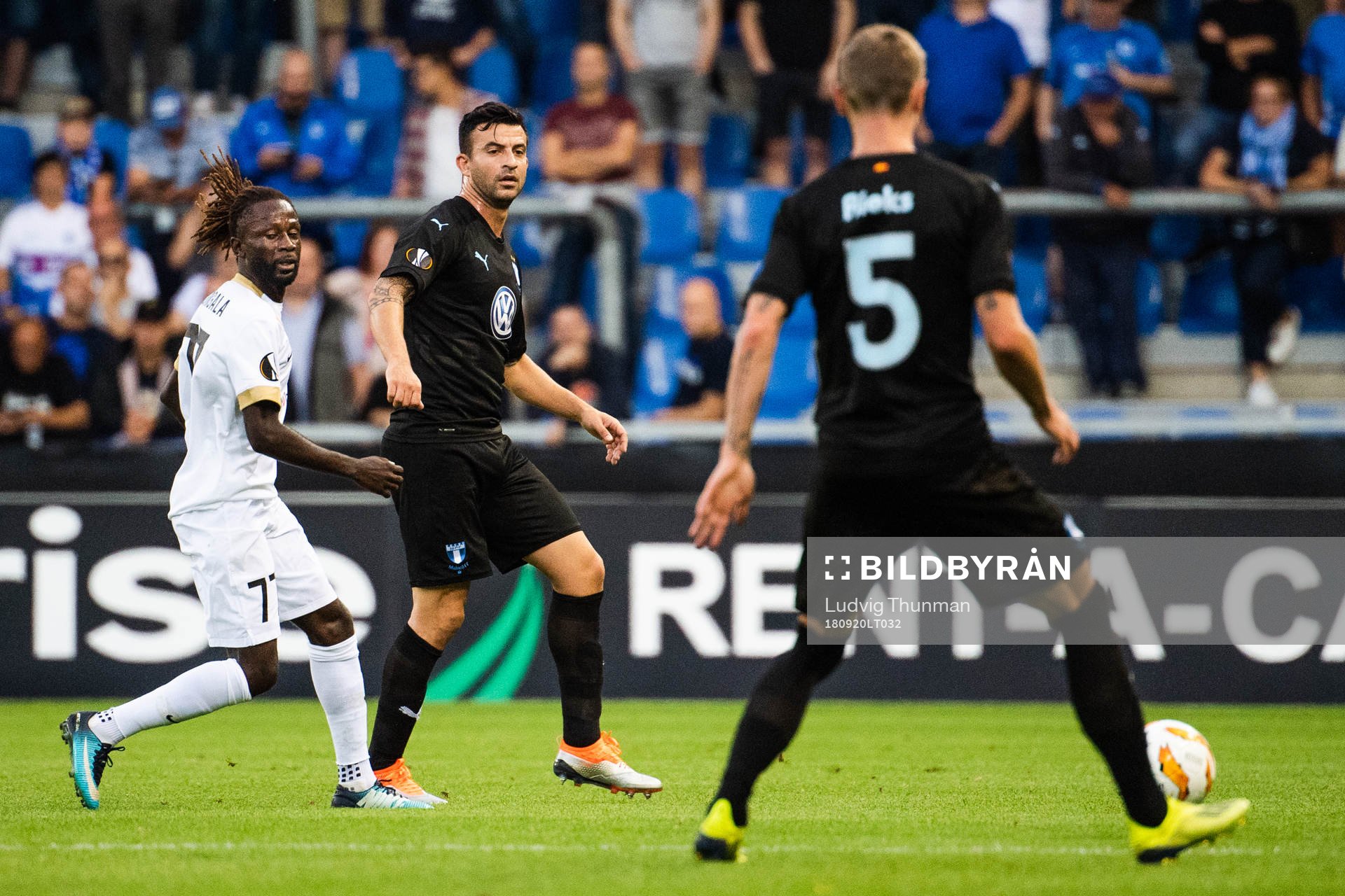 Dieumerci Ndongala of Genk and Behrang Safari of Malmö FF