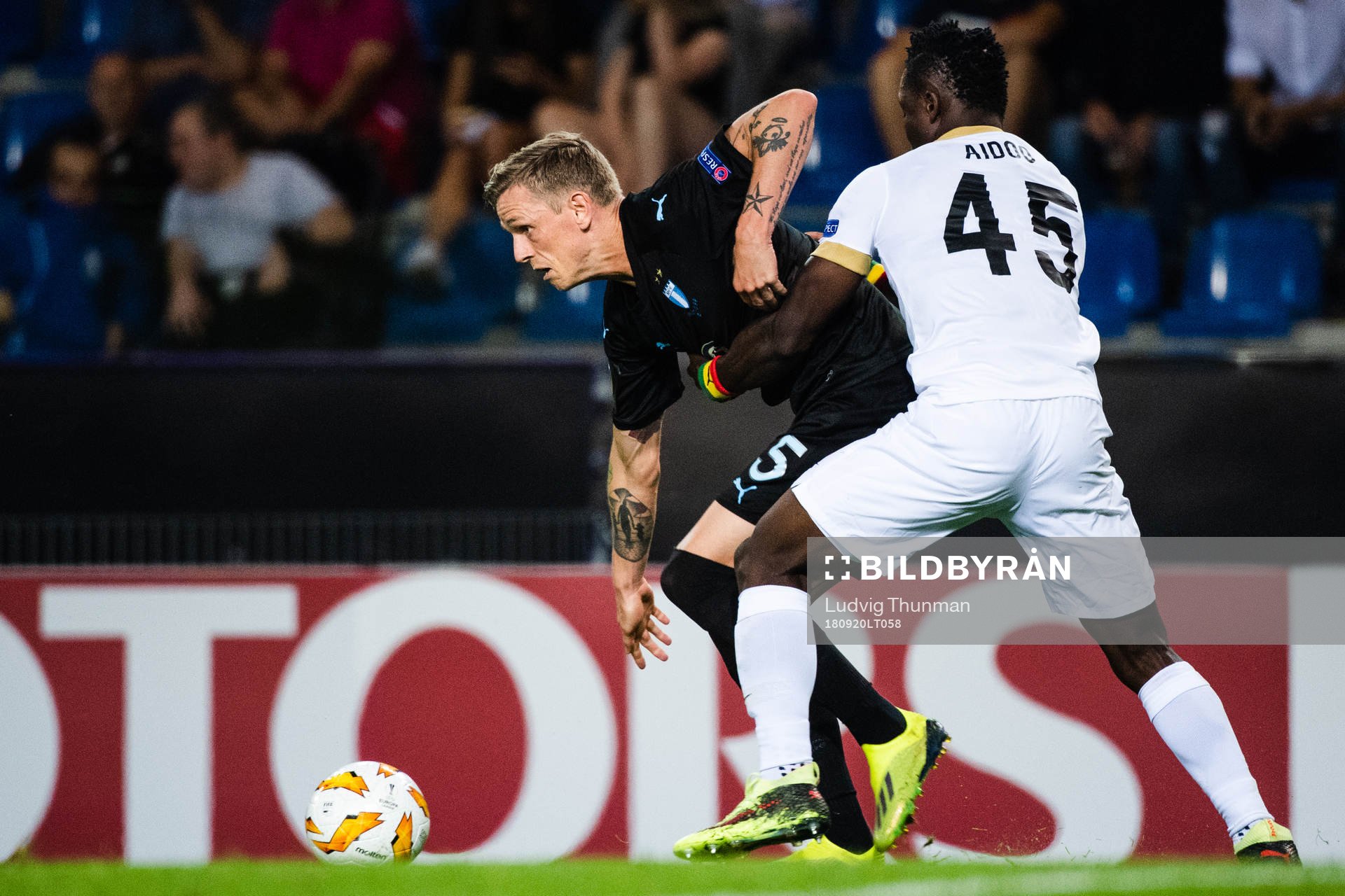 Sören Rieks of Malmö FF and Joseph Aidoo of Genk competes