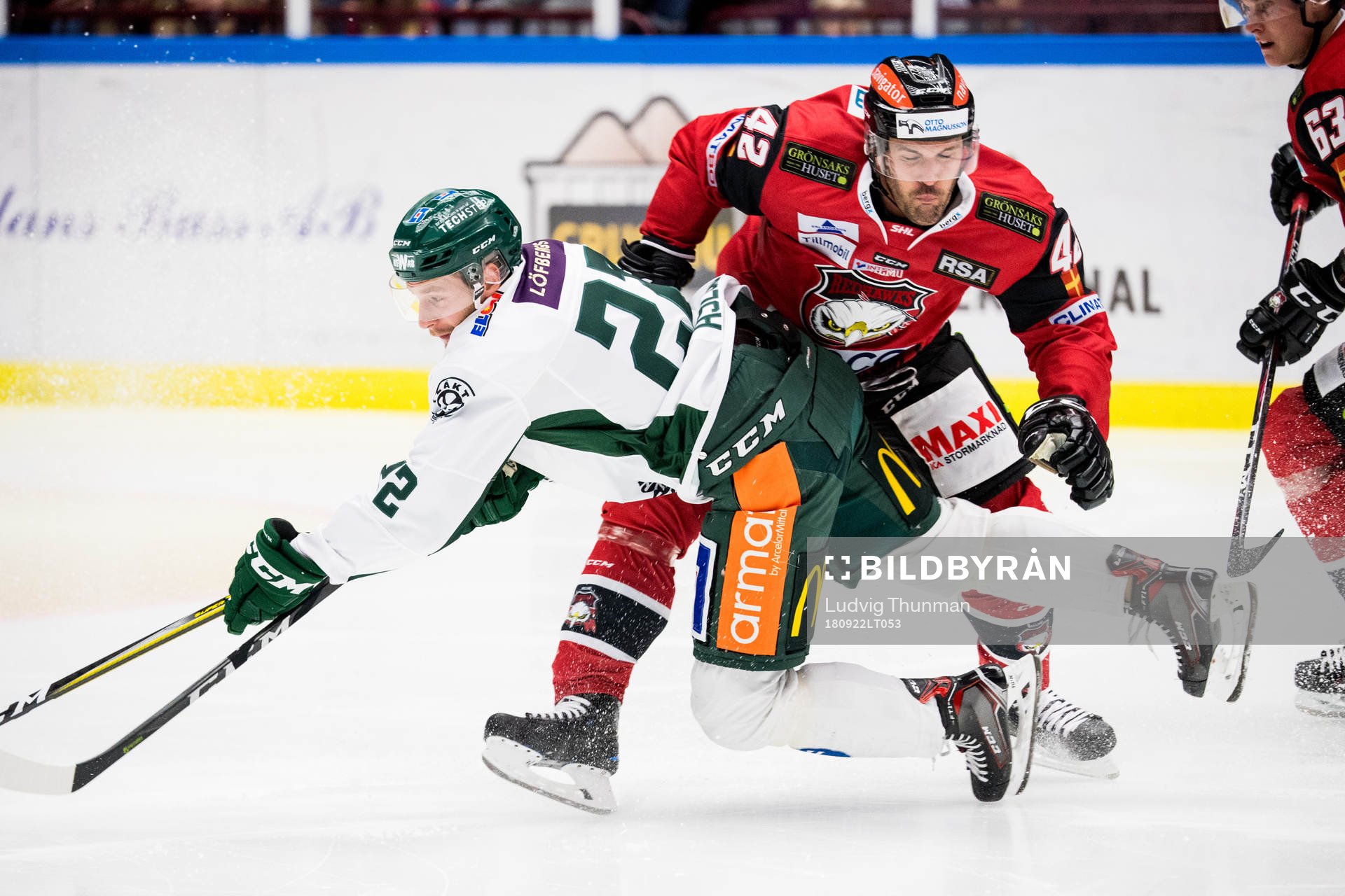 Färjestads Per Åslund och Malmö Redhawks Niklas Arell