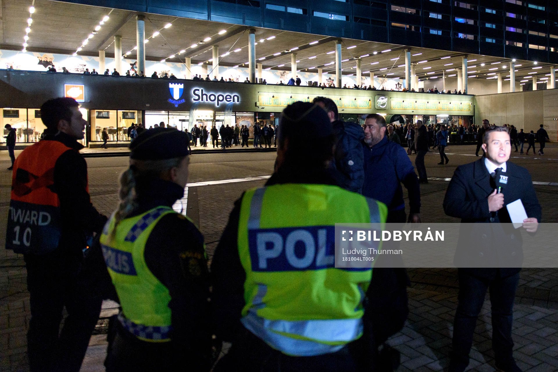 Police and spectators outside the stadium