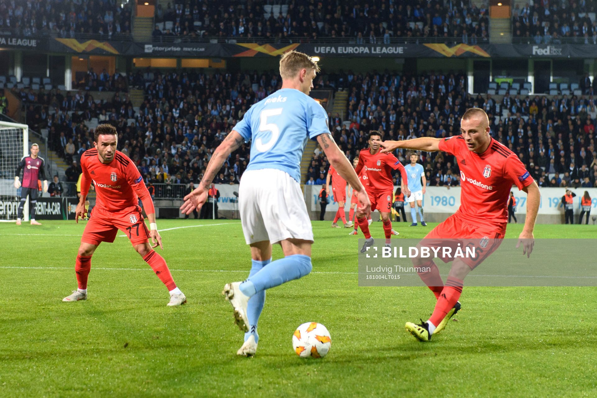 Sören Rieks of Malmö FF against Gökhan Gönül and Gökan Före of Besiktas during the Europa League group stage match between Malmö FF and Besiktas on October 4, 2018 in Malmö.