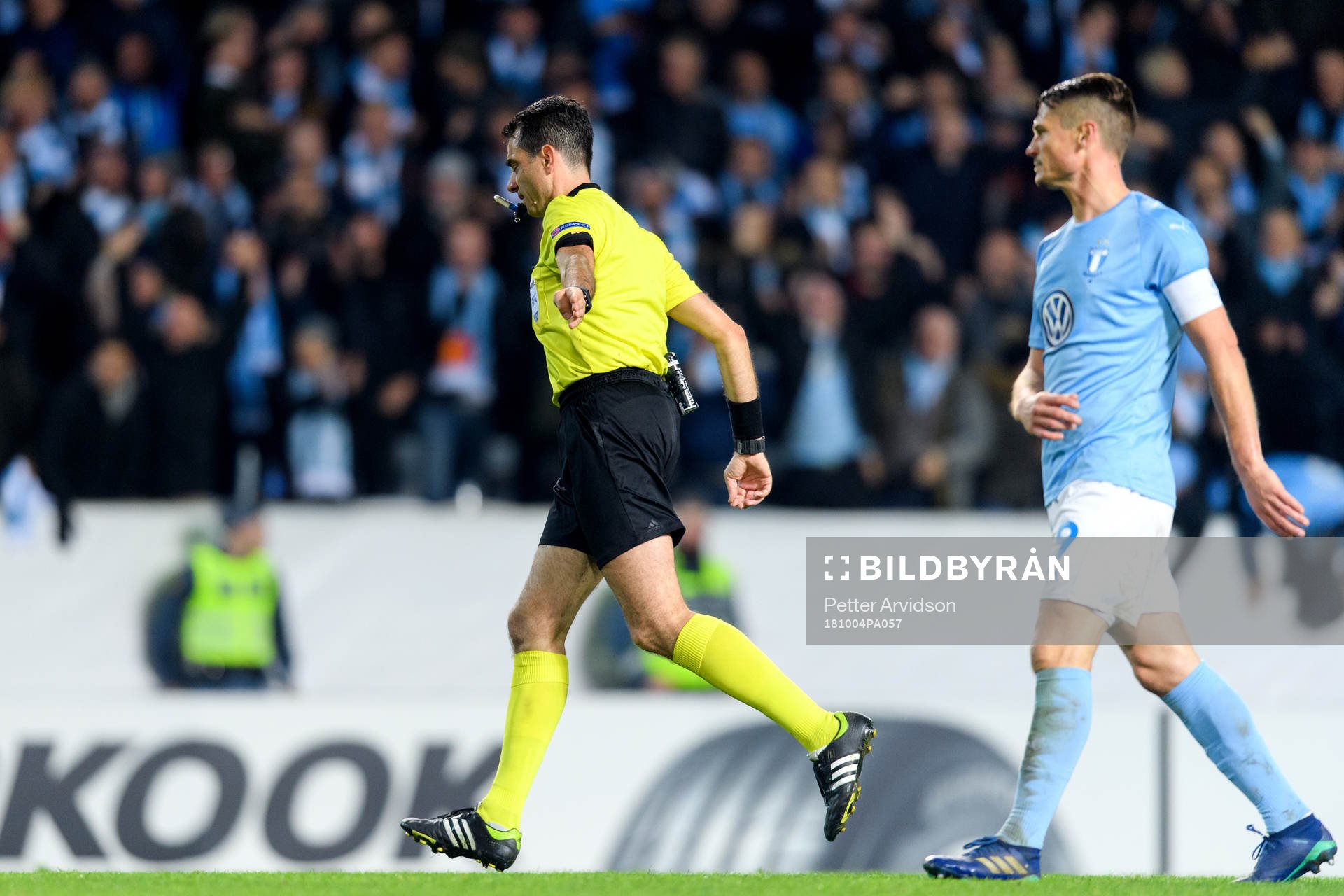 Referee Aleksandar Stavrev points at the penalty spot