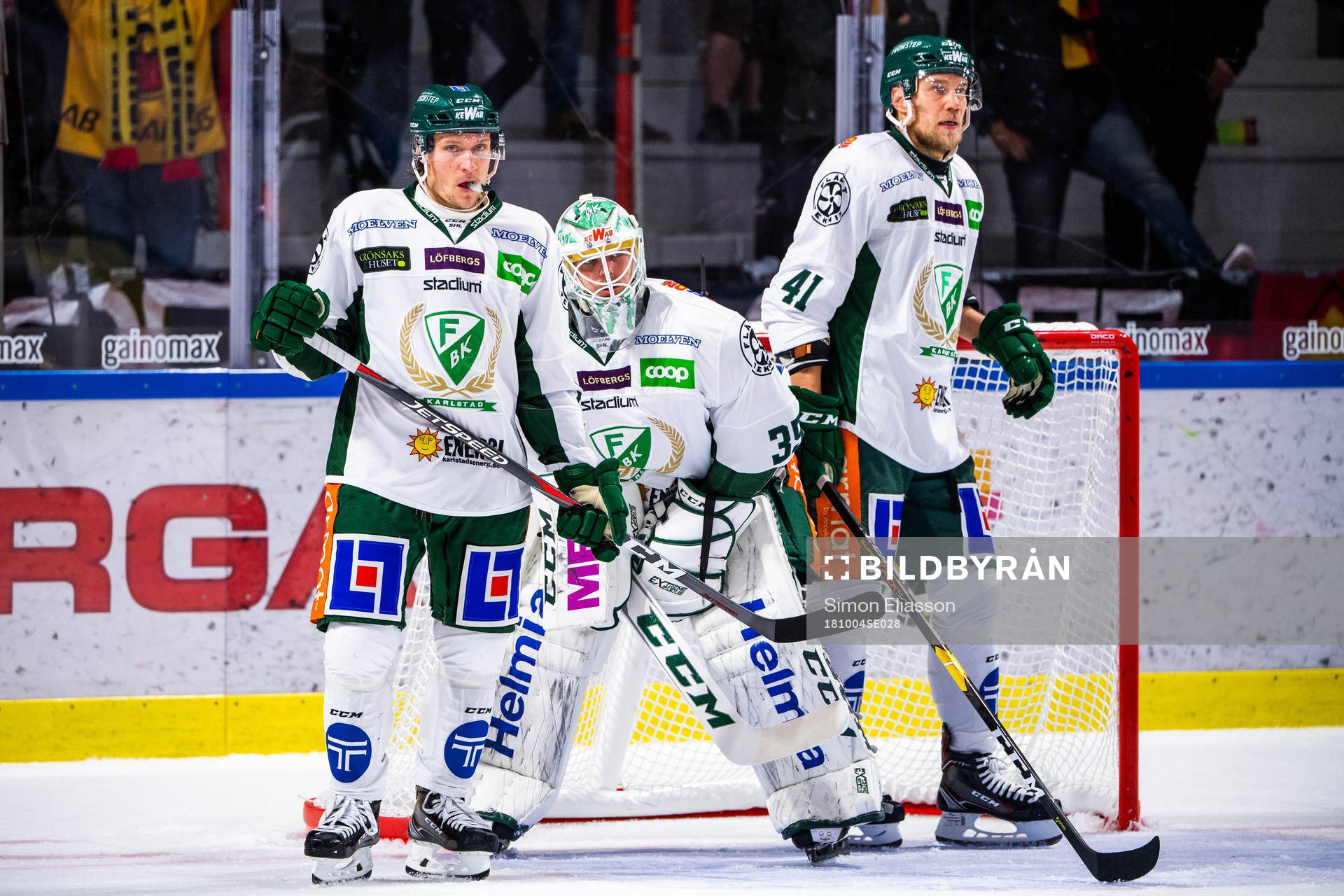 Färjestads Jesper Olofsson, målvakt Adam Werner  och