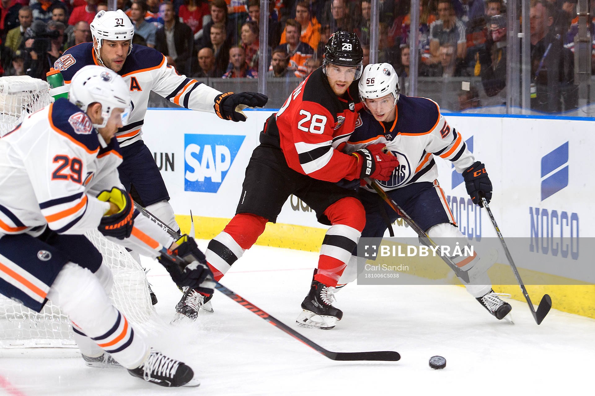Damon Severson of the New Jersey Devils and Kailer Yamamoto
