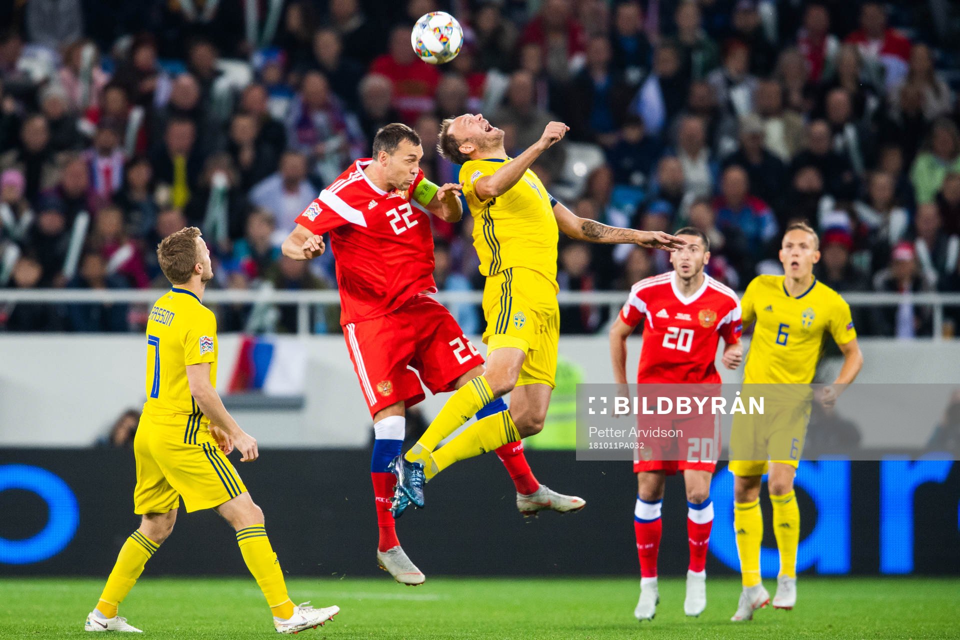 Artem Dzyuba of Russia and Andreas Granqvist of Sweden