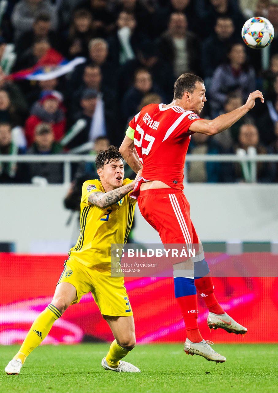Victor Nilsson Lindelöf of Sweden and Artem Dzyuba of
