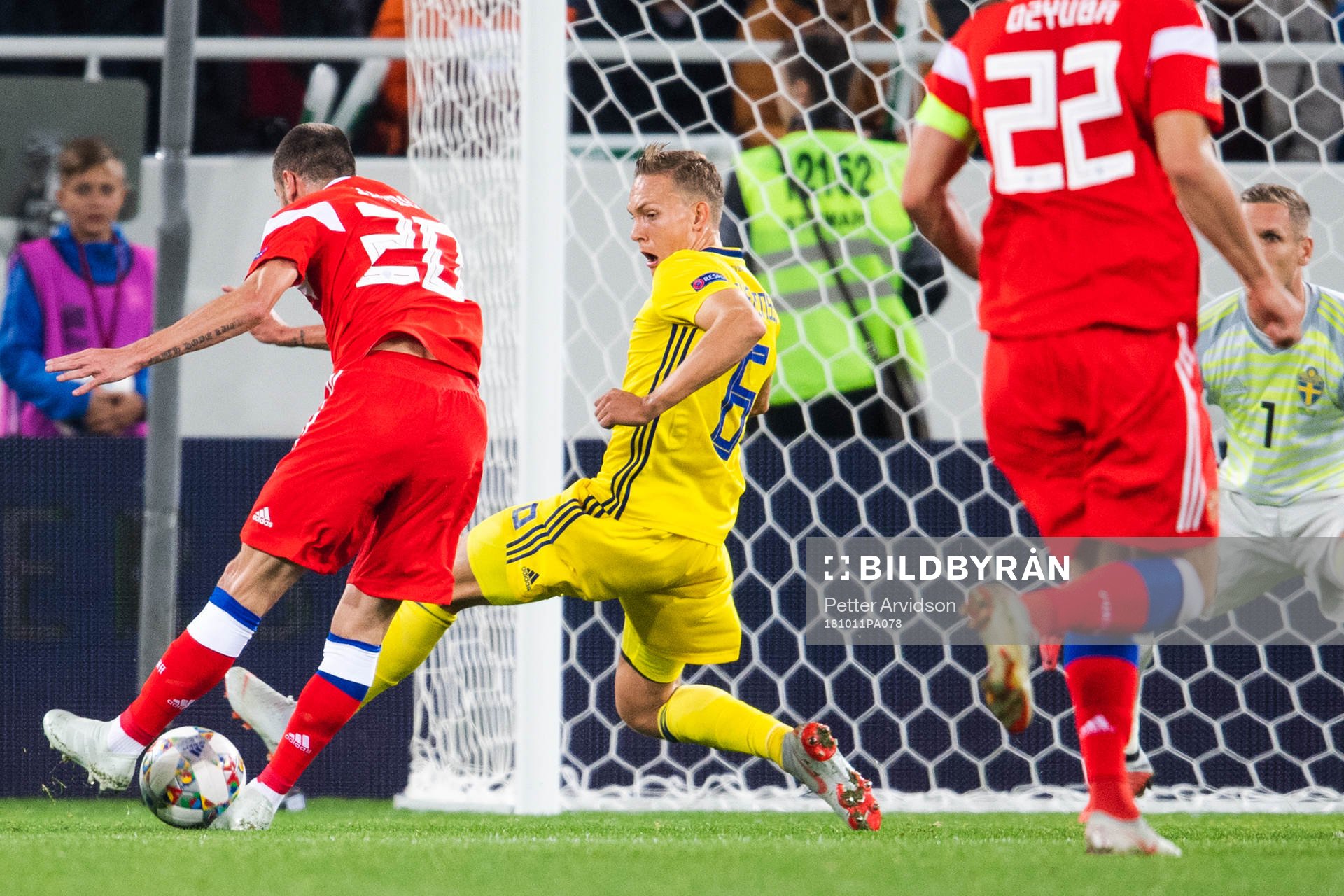Ludwig Augustinsson of Sweden blocks a shot frpm Alexey