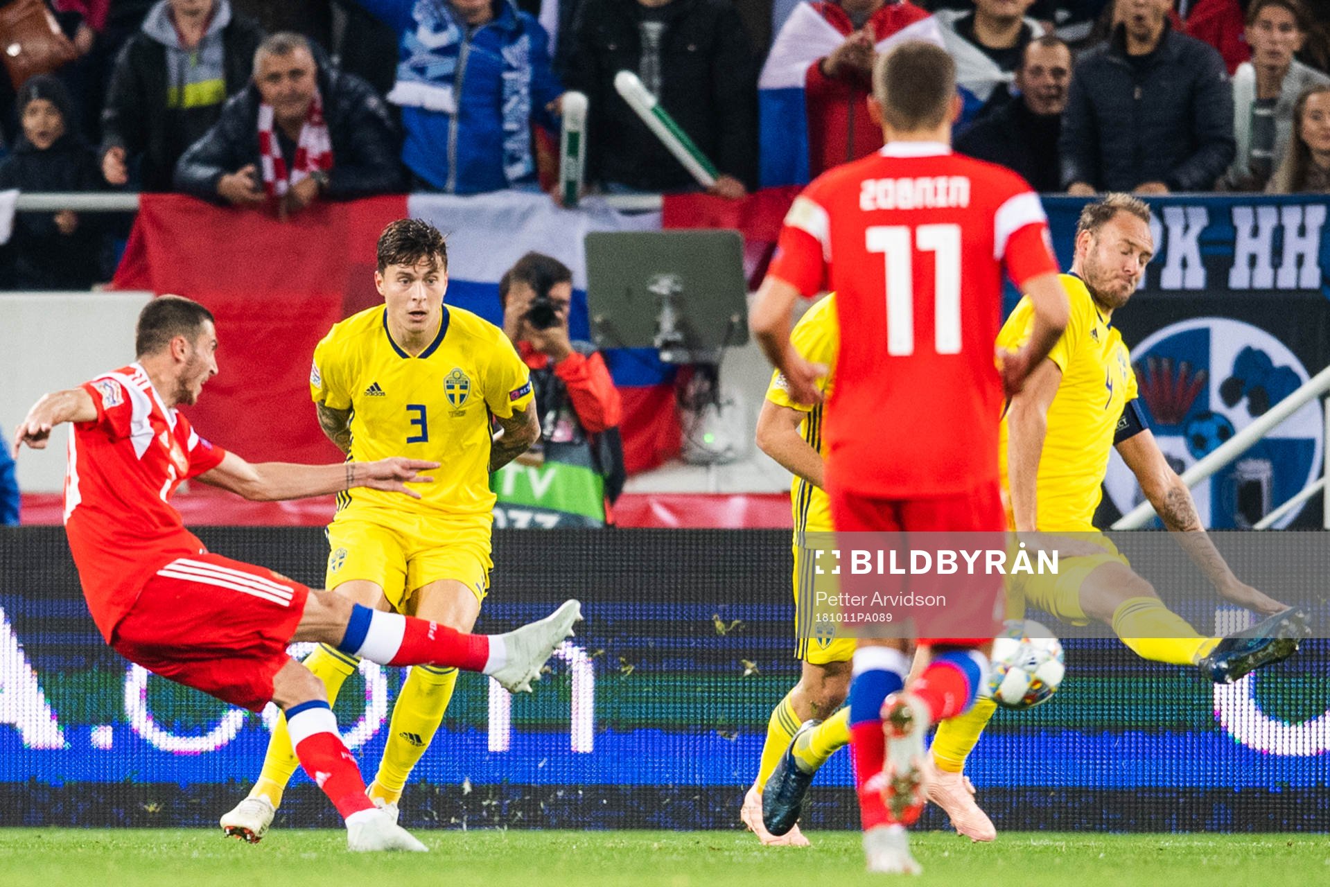 Andreas Granqvist of Sweden blocks a shot from Alexey Ionov