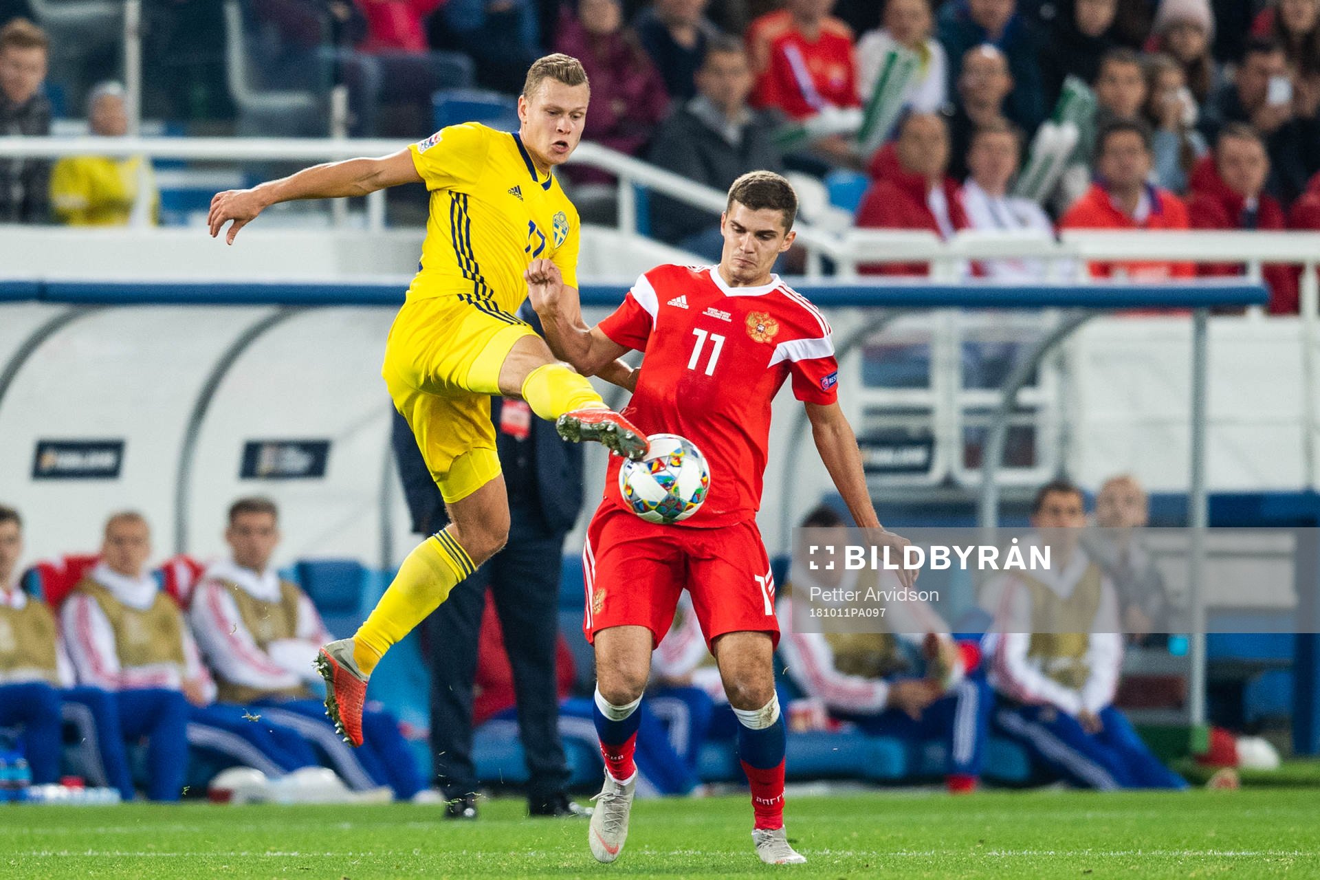 Viktor Claesson of Sweden and Roman Zobnin of Russia competes for the ball during the Nations League match between Russia and Sweden on October 11, 2018 in Kaliningrad.