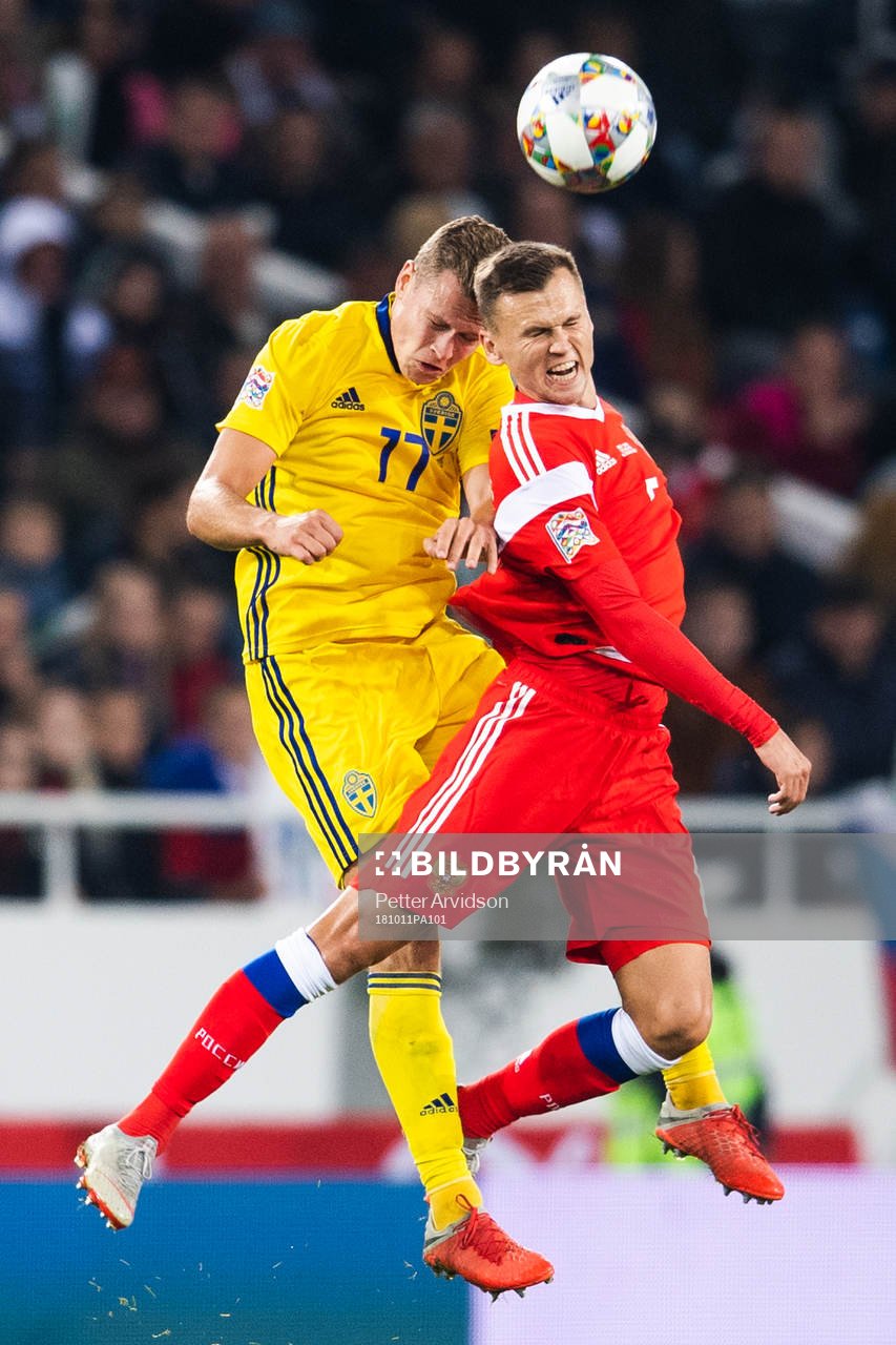 Viktor Claesson of Sweden and Denis Cheryshev of Russia
