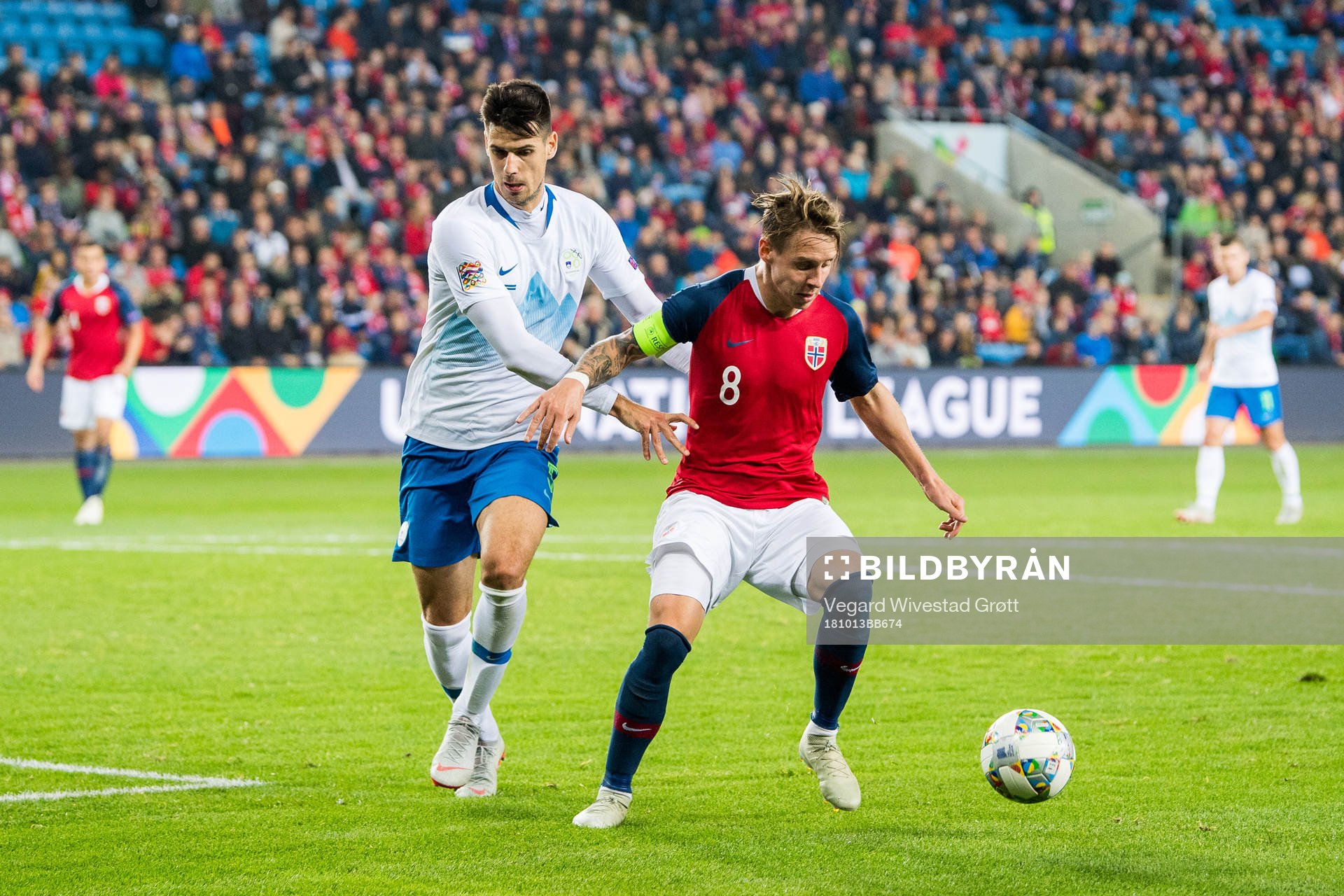 Nemanja Mitrovic of Slovenia and Stefan Johansen of Norway