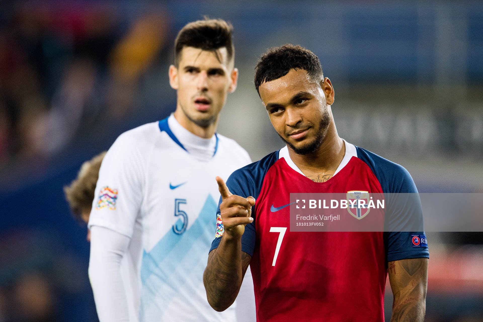 Nemanja Mitrovic of Slovenia and Joshua King of Norway