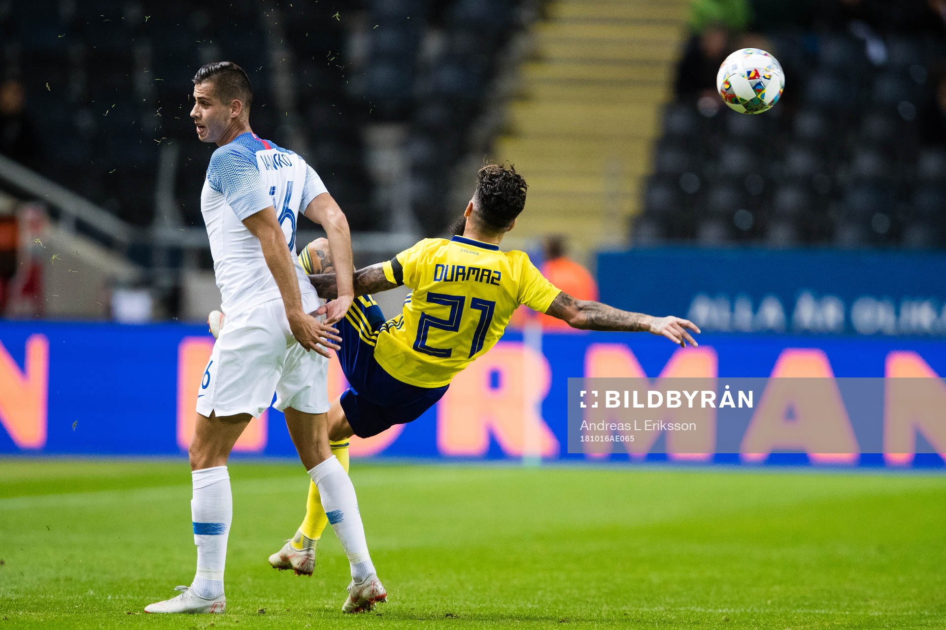David Hancko of Slovakia and Jimmy Durmaz of Sweden