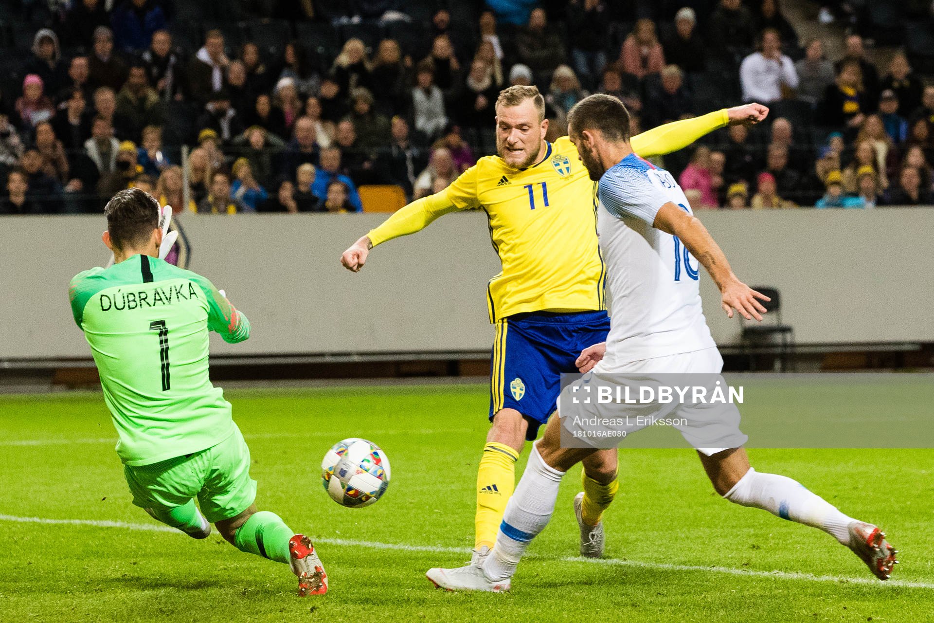 John Guidetti of Sweden scores 1-0 behind goalkeeper Martin