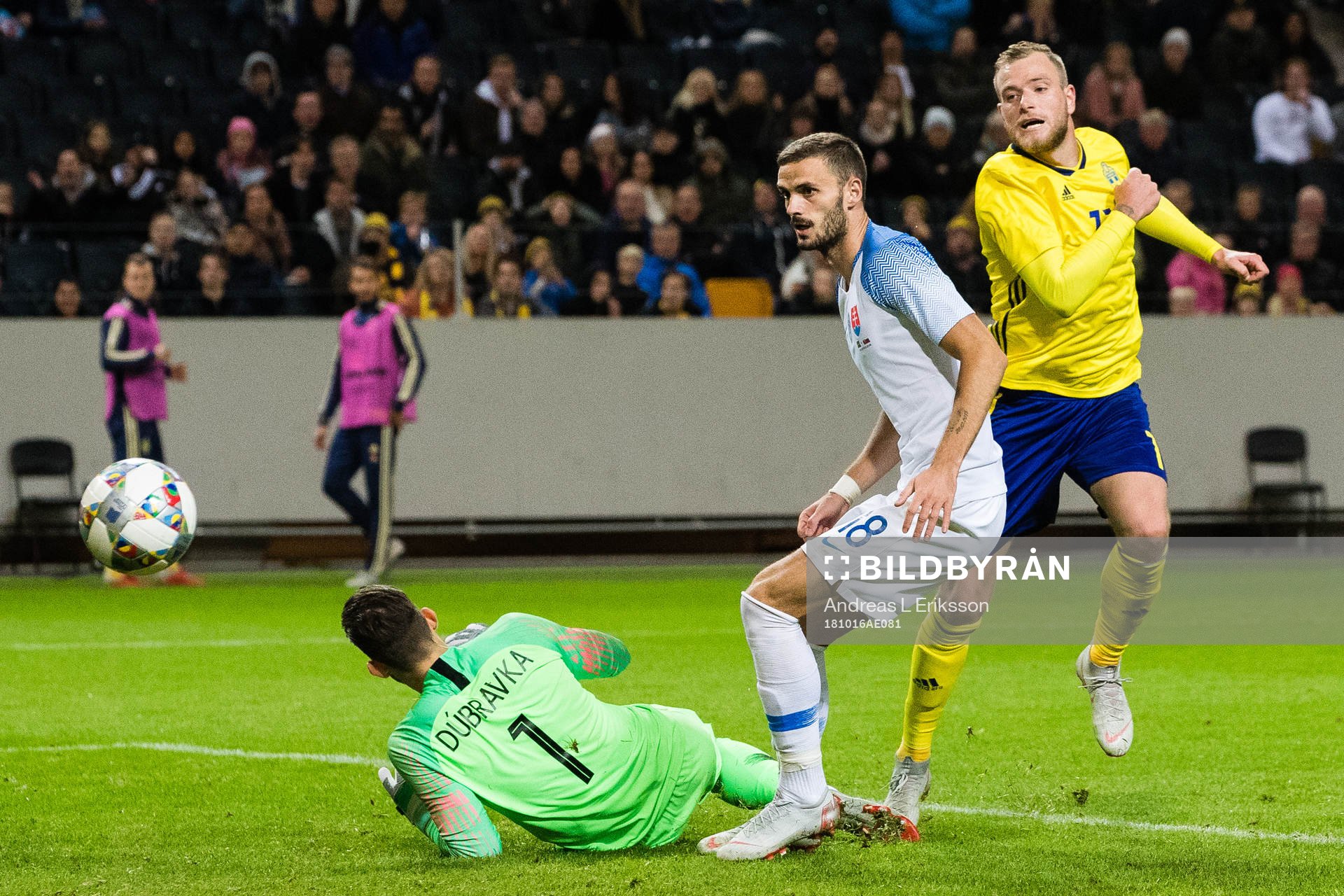 John Guidetti of Sweden scores 1-0 behind goalkeeper Martin