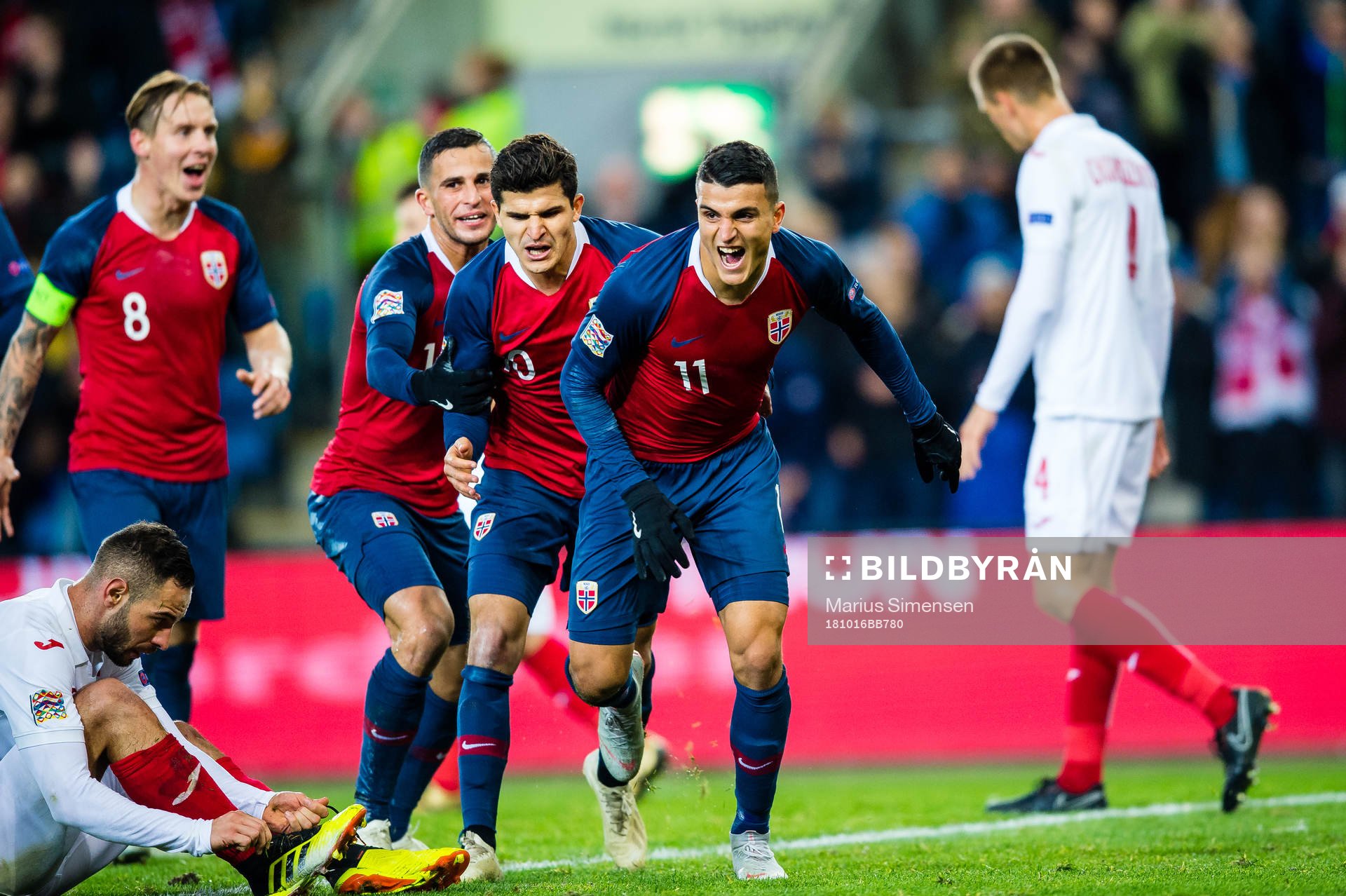Mohamed Elyounoussi of Norway celebrates with teammates