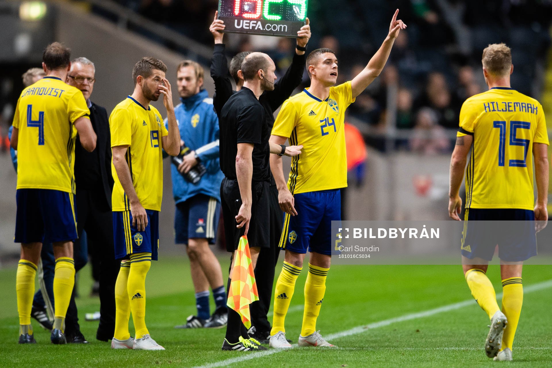 Kristoffer Peterson swaps with Oscar Hiljemark of Sweden