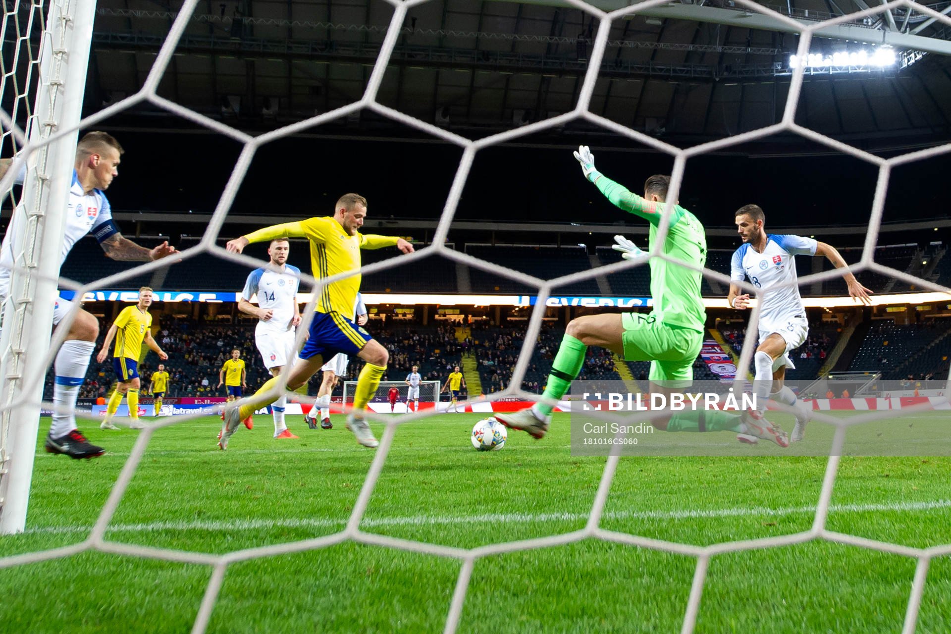 John Guidetti of Sweden against goalkeeper Martin Dubravka