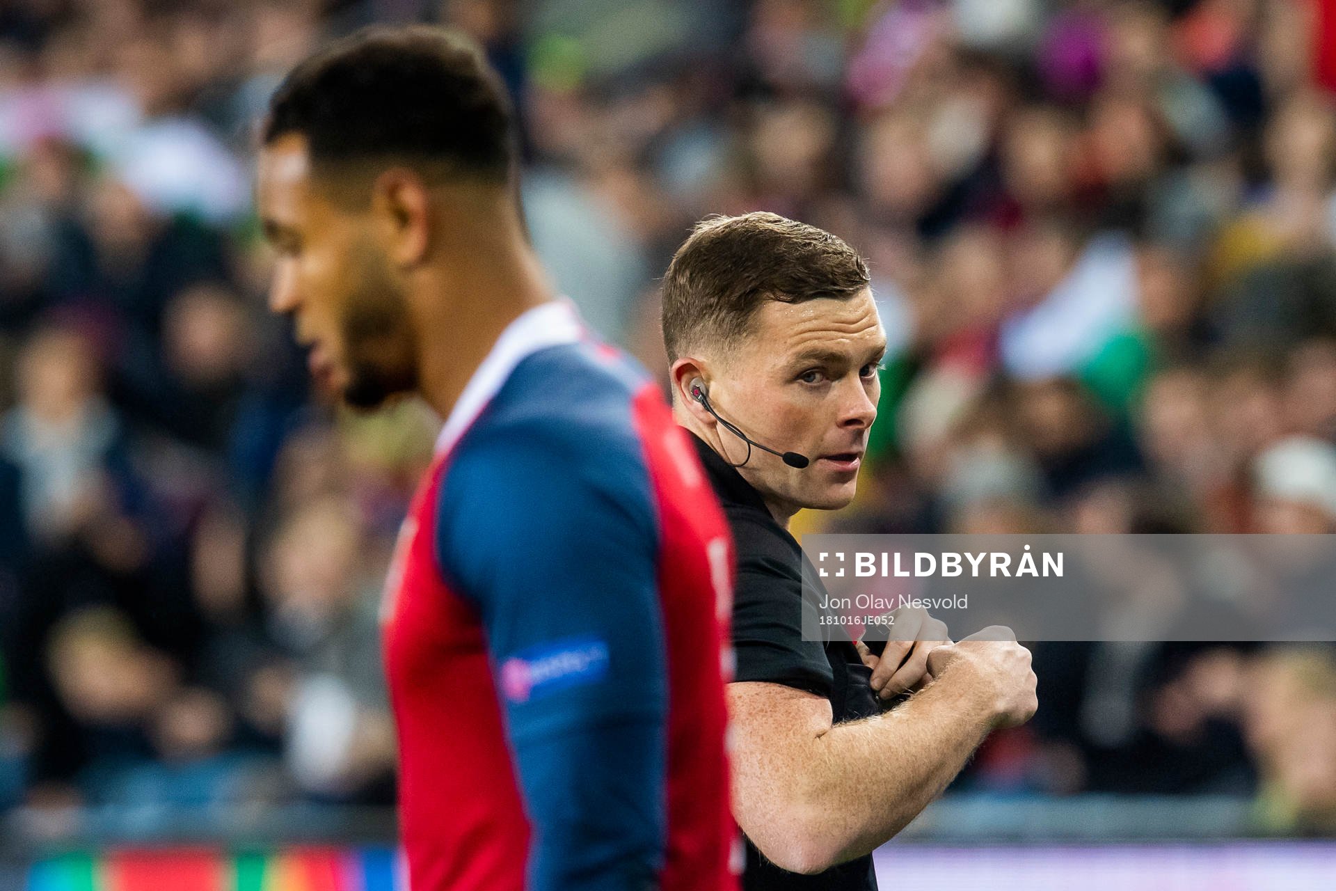 Joshua King of Norway and referee John Beaton of Scotland