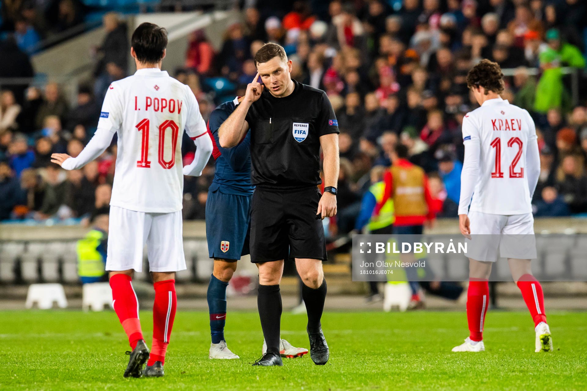 Ivelin Popov of Bulgaria and referee John Beaton of Scotland