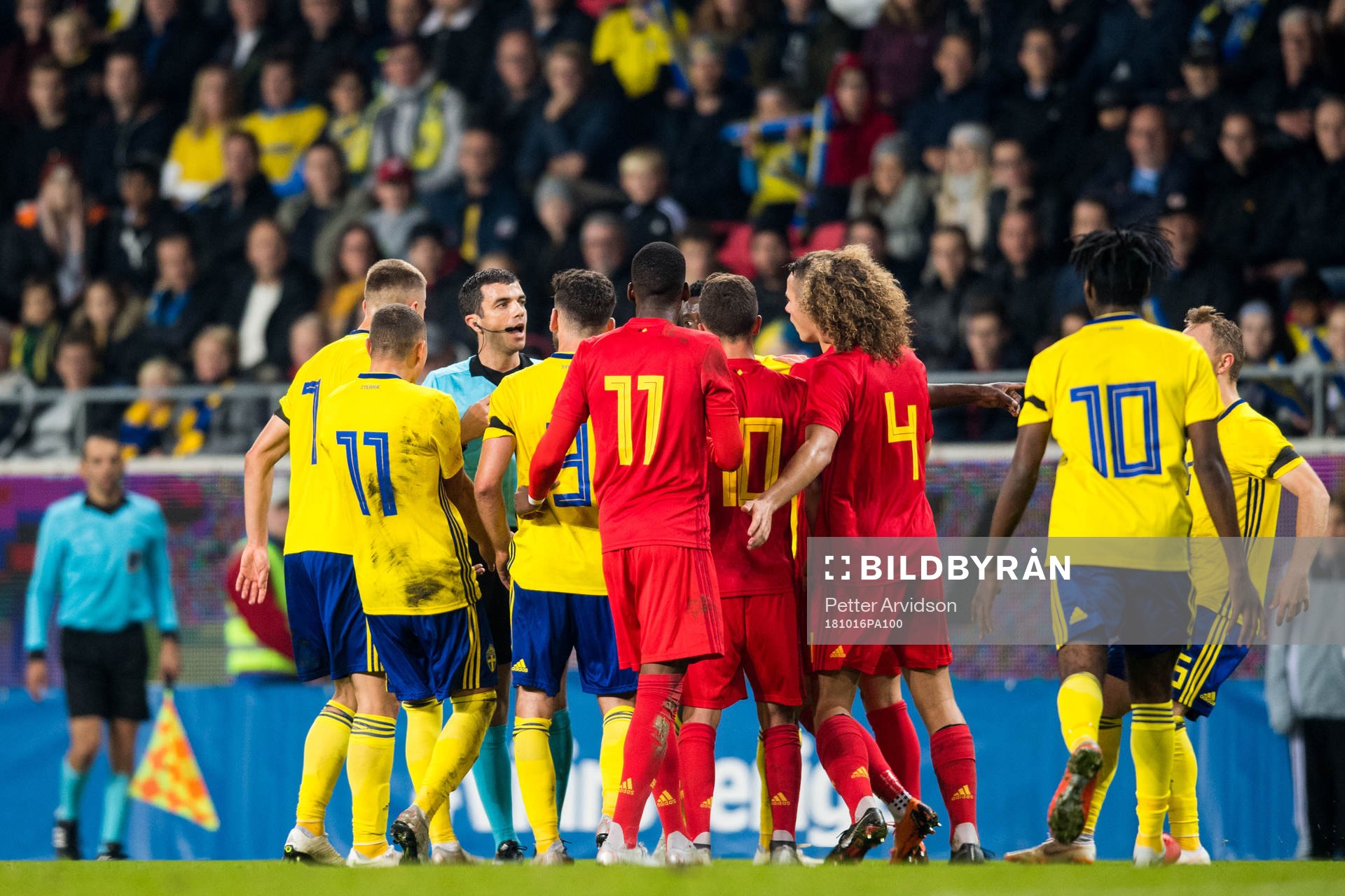 Referee Frank Schneider talks to the players