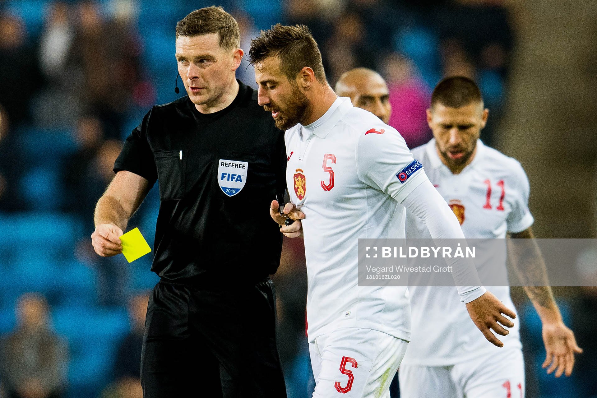 Referee John Beaton of Scotland gives a yellow card to Nikolay Bodurov of Bulgaria during the Nations League match between Norway and Bulgaria on October 16, 2018 in Oslo.