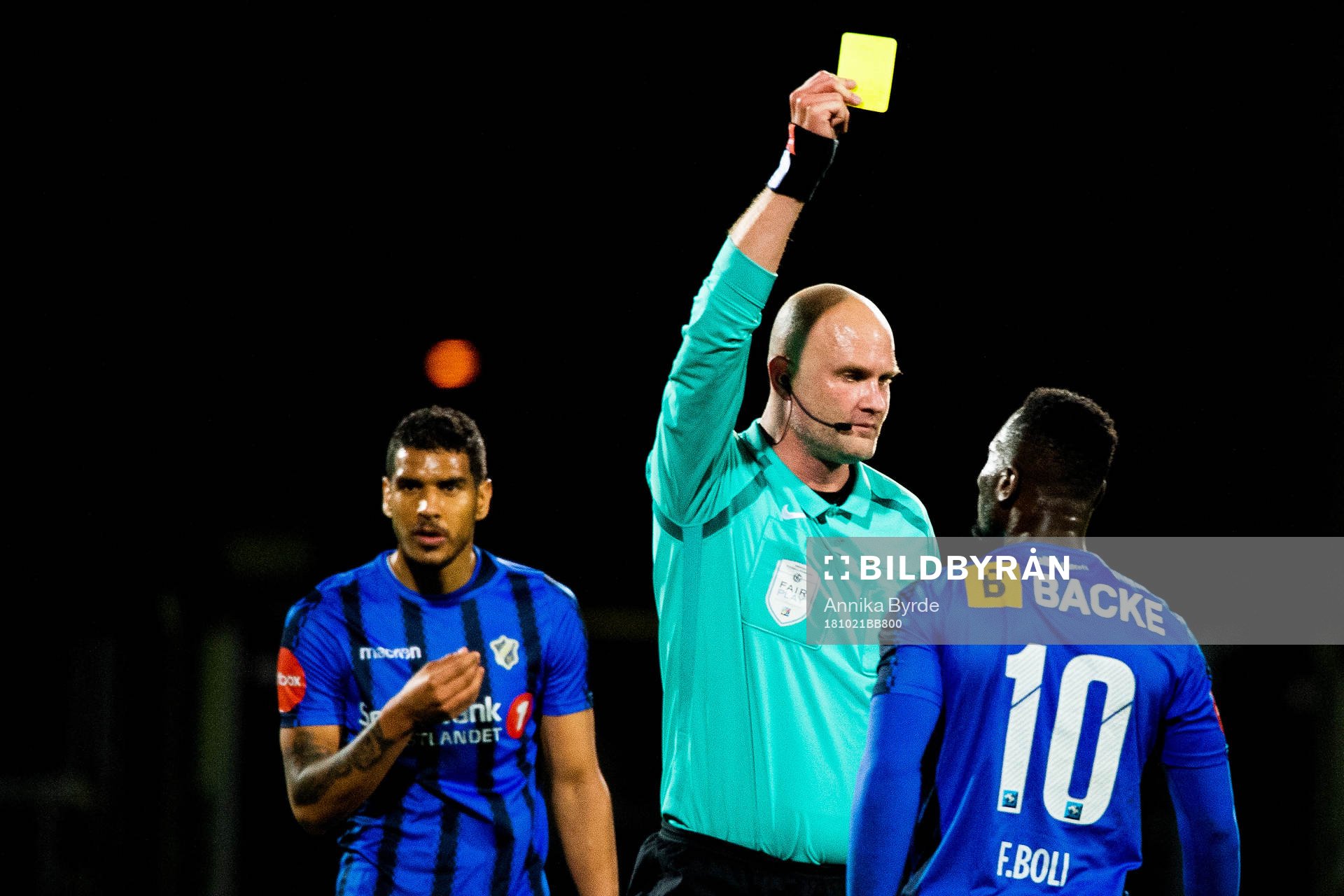 Franck Boli of Stabæk is shown a yellow card by referee