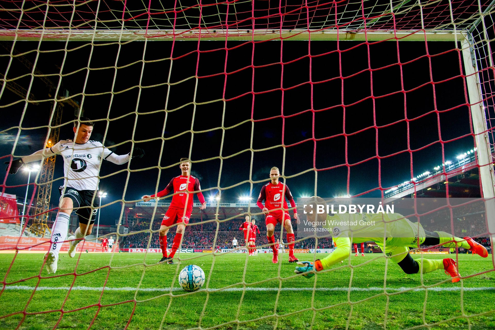 Pål André Helland of Rosenborg sees goalkeeper Markus