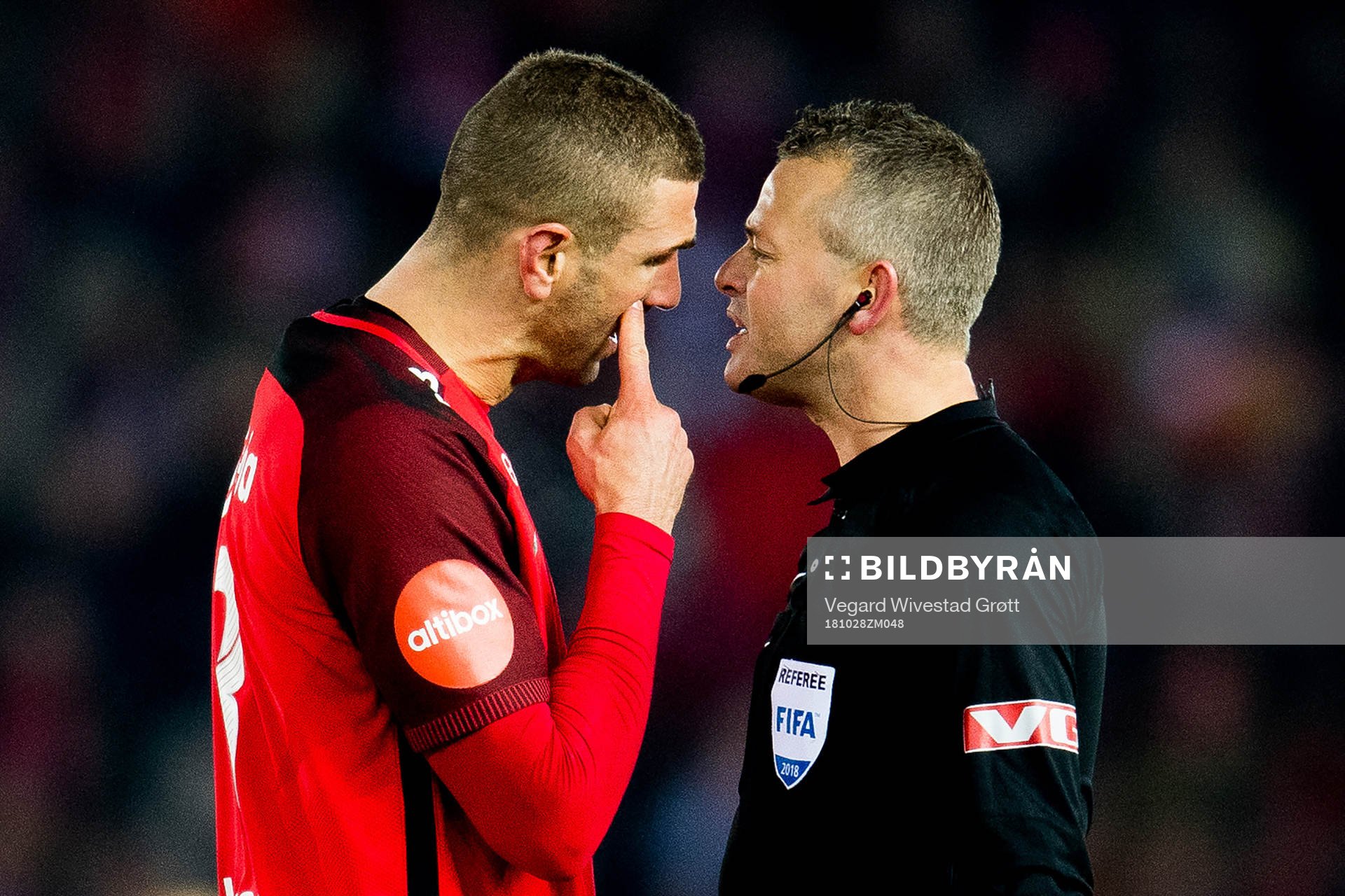 Azar Karadas of Brann argues with Svein Oddvar Moen, referee