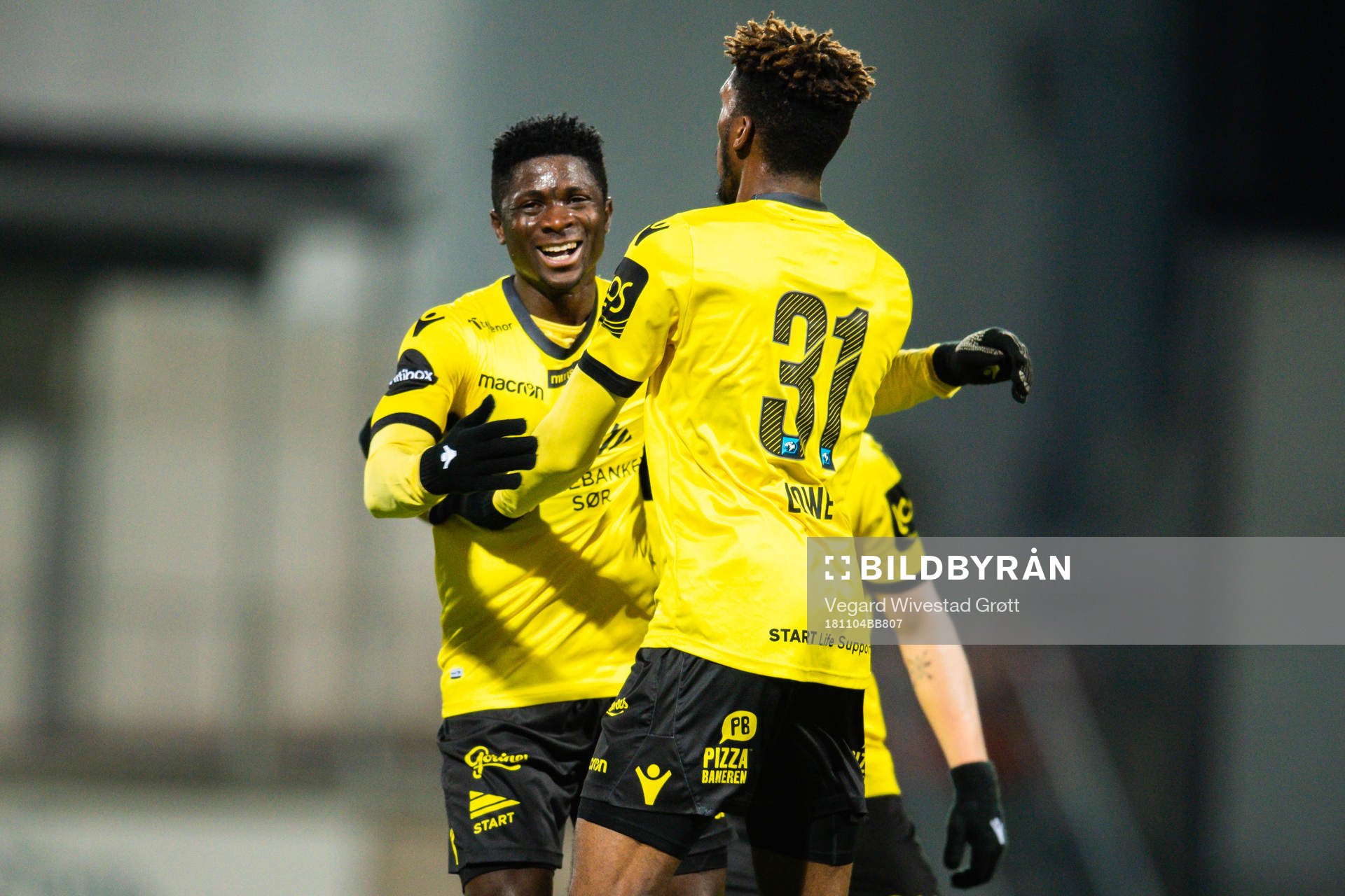 Damion Lowe of Start celebrates with teammate Afeez Aremu after scoring the 1-1 goal during the Eliteserien match between Sandefjord and Start on November 4, 2018 in Sandefjord.