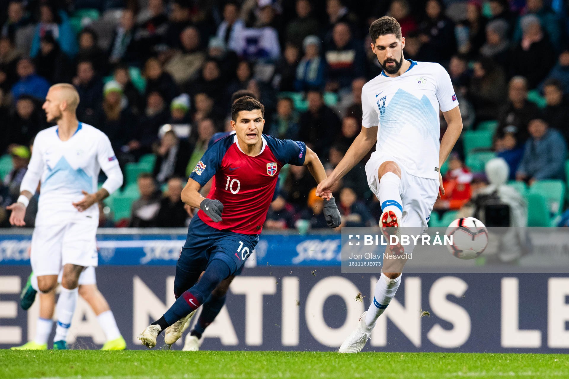 Tarik Elyounoussi of Norway and Miha Mevlja of Slovenia