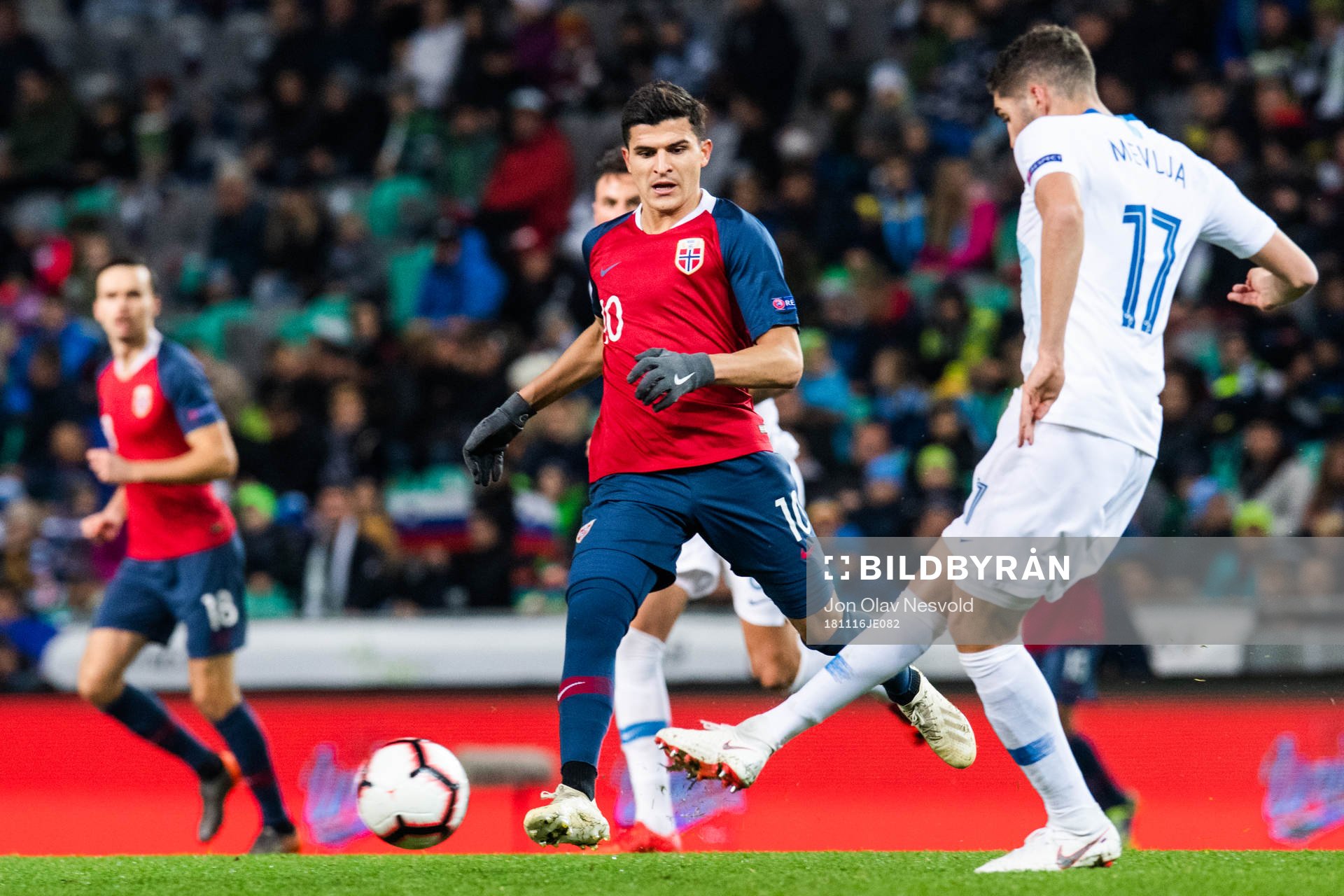 Tarik Elyounoussi of Norway and Miha Mevlja of Slovenia