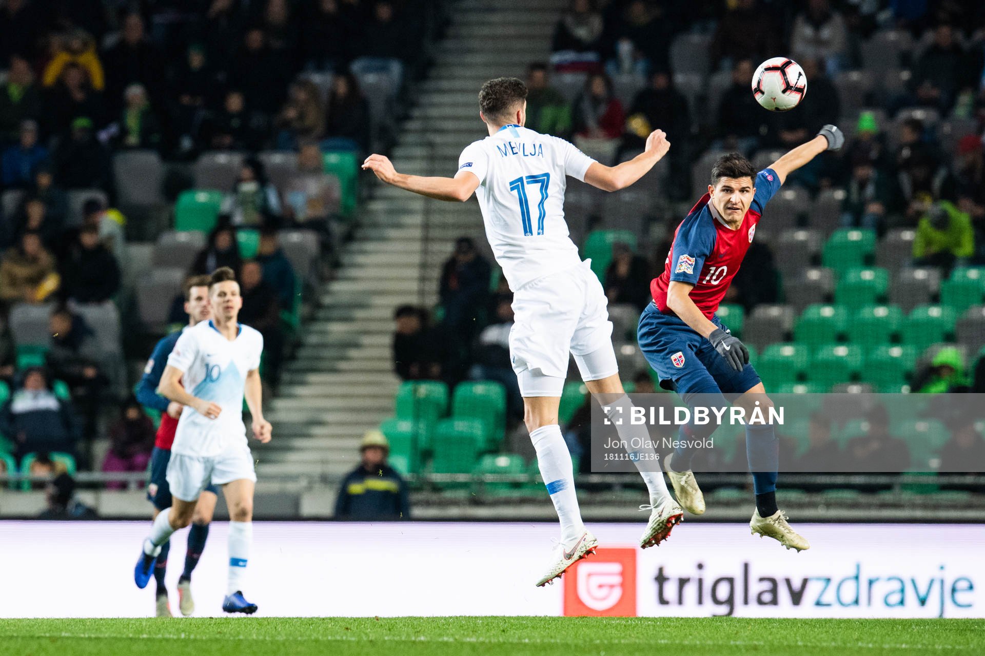 Miha Mevlja of Slovenia and Tarik Elyounoussi of Norway
