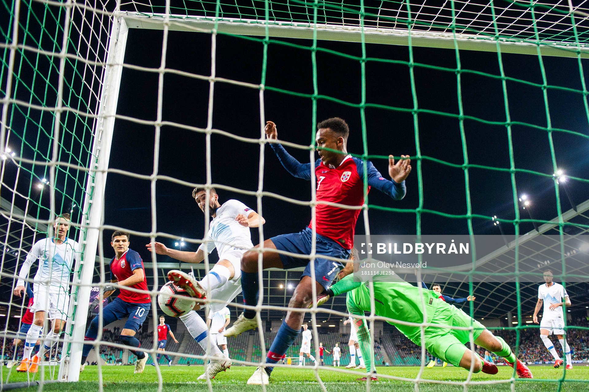 Miha Mevlja of Slovenia saves a chance by Ola Kamara of