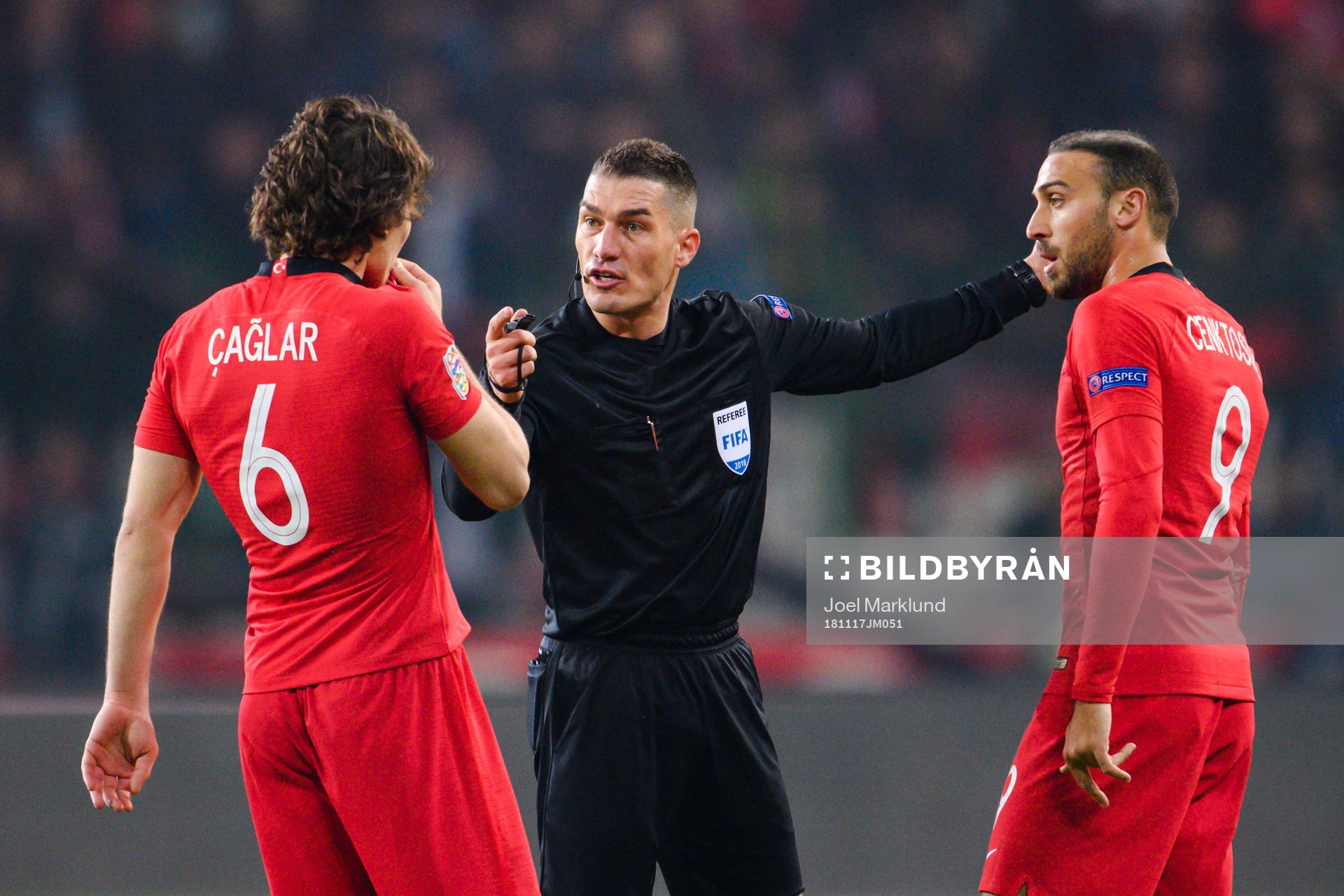 Caglar Söyuncu of Turkey in a discussion with referee
