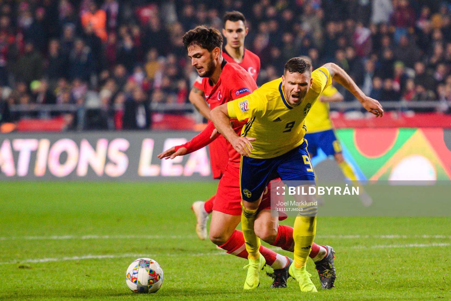 Okay Yokuslu of Turkey in a duel with Marcus Berg of Sweden during the Nations League football match between Turkey and Sweden on November 17, 2018 in Konya.