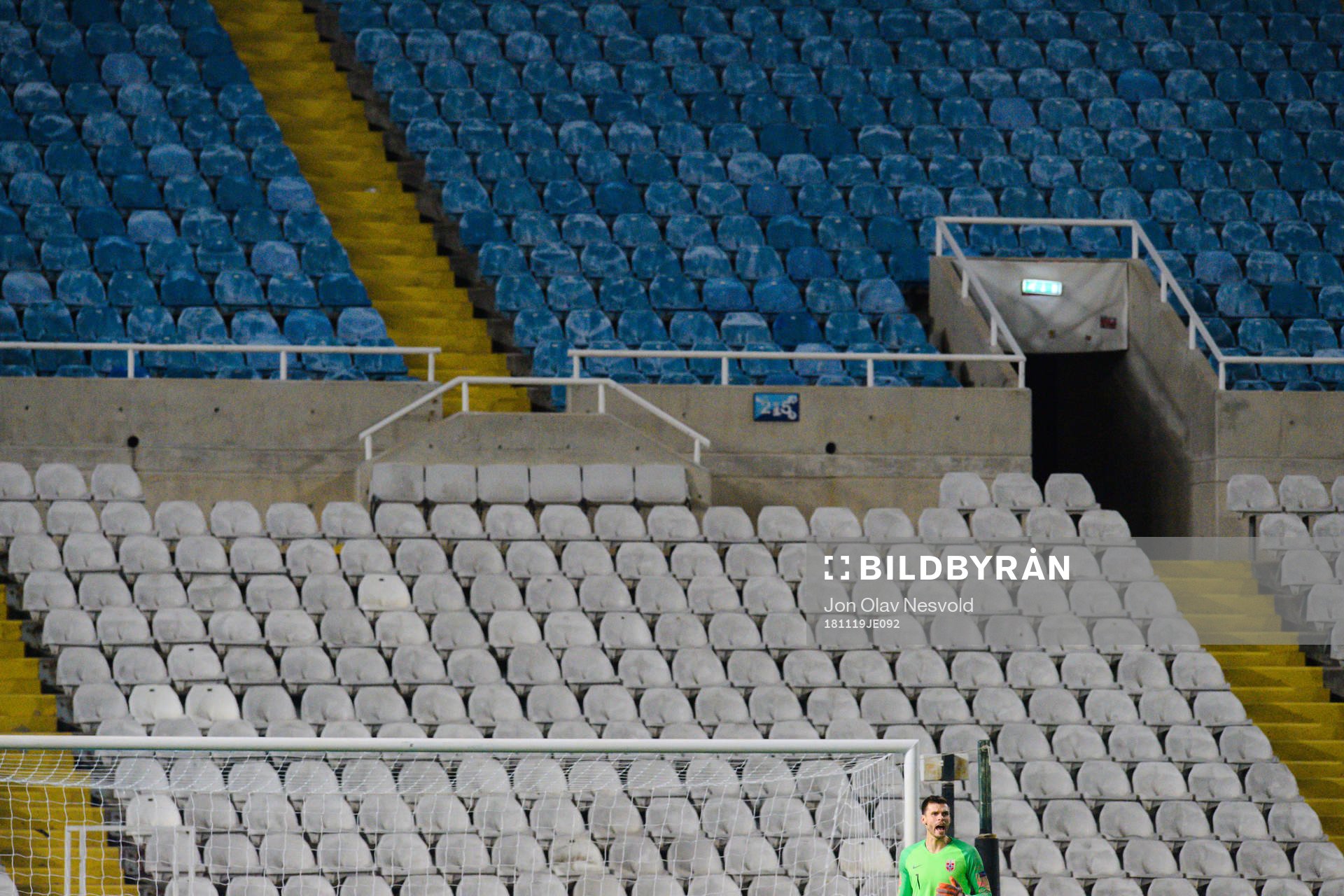 Empty seats behind Goalkeeper Rune Almenning Jarstein of