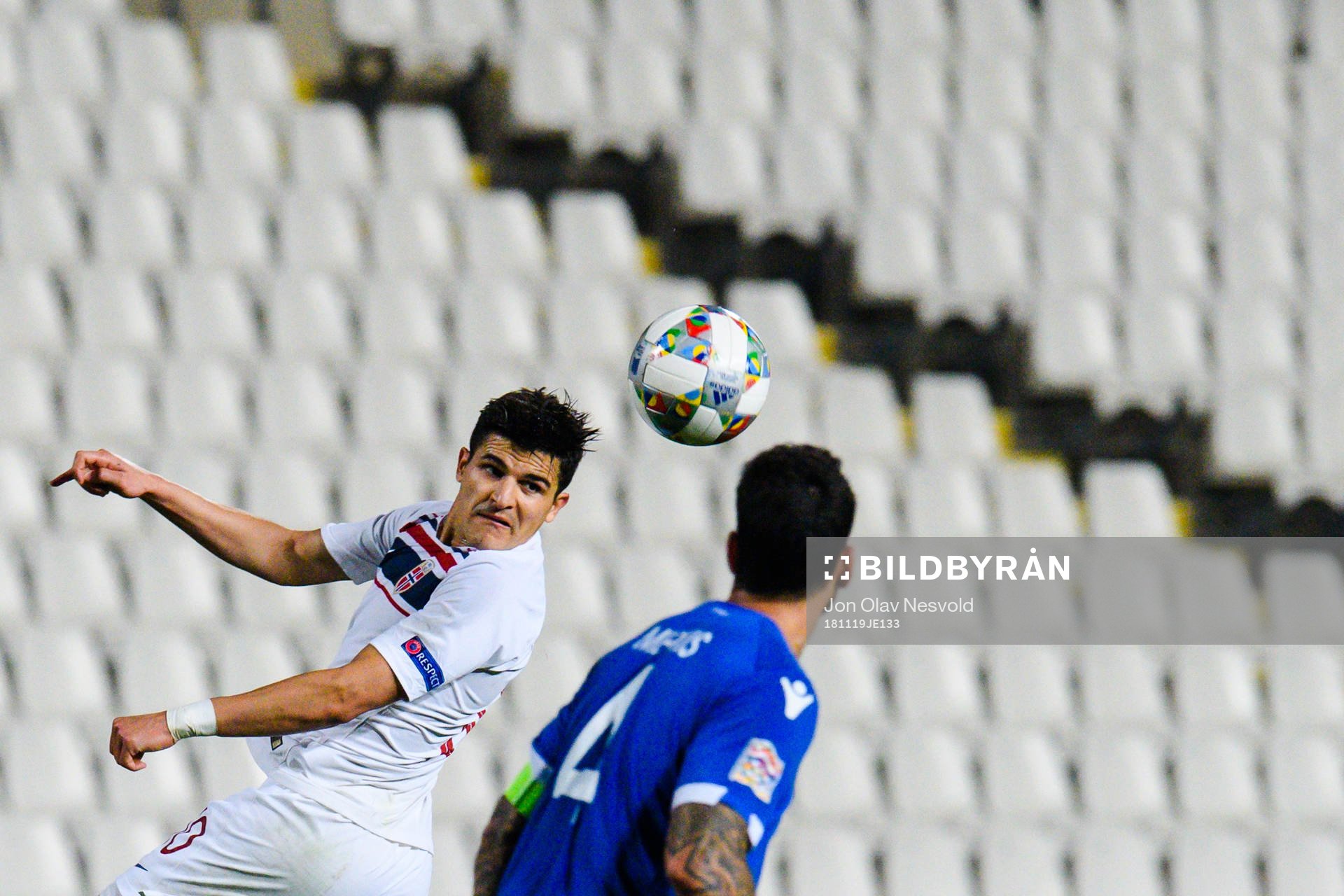 Tarik Elyounoussi of Norway and Giorgos Merkis of Cyprus
